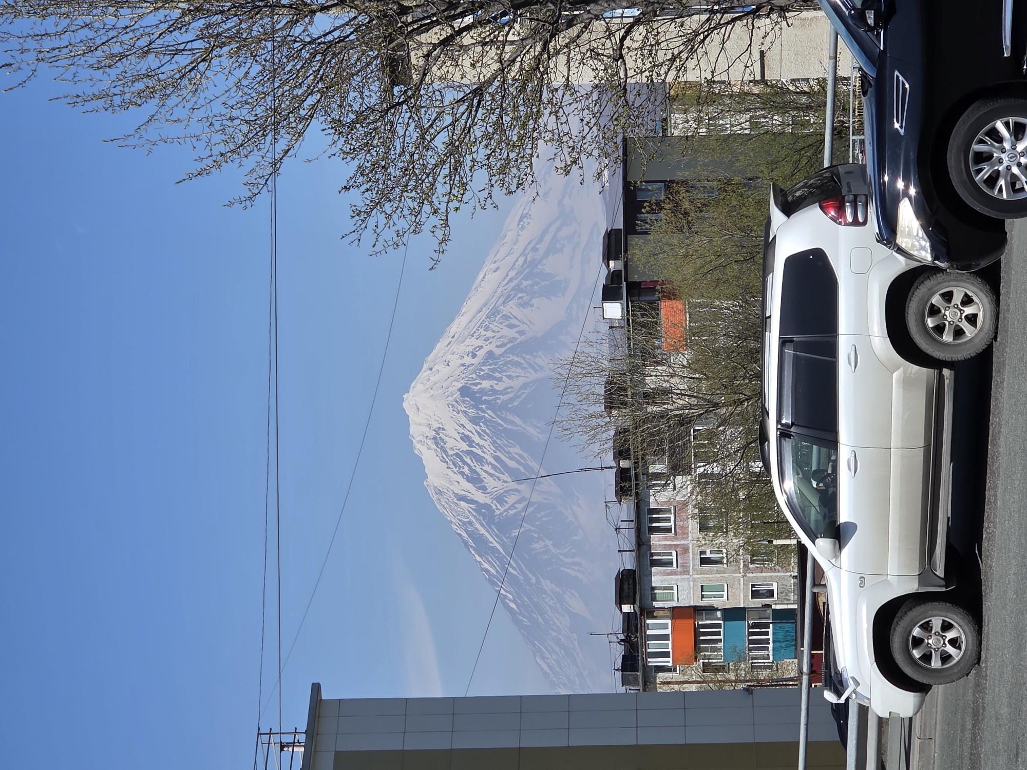Clear skies frame snow-capped volcano in Petropavlovsk-Kamchatsky