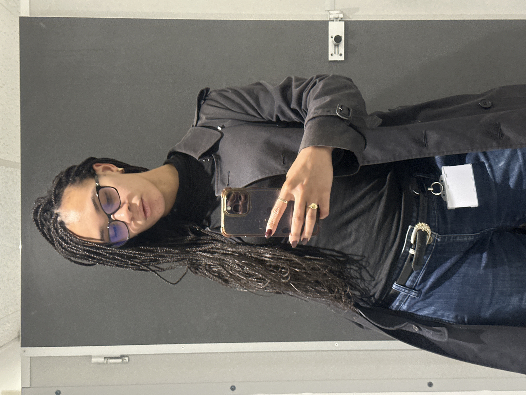 Person takes indoor selfie in London wearing black outfit