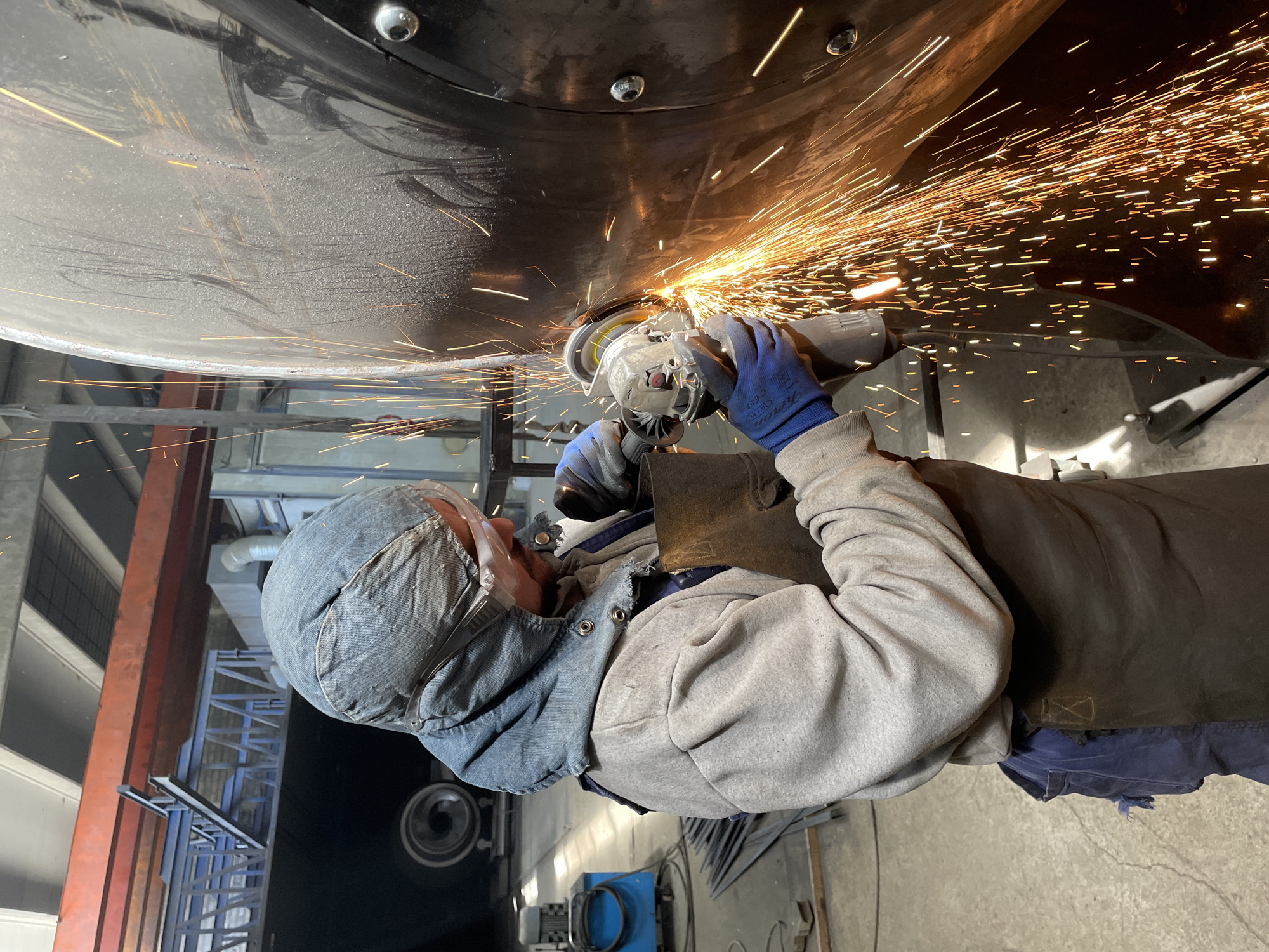Welder works on metal object in Zaljevo, Montenegro