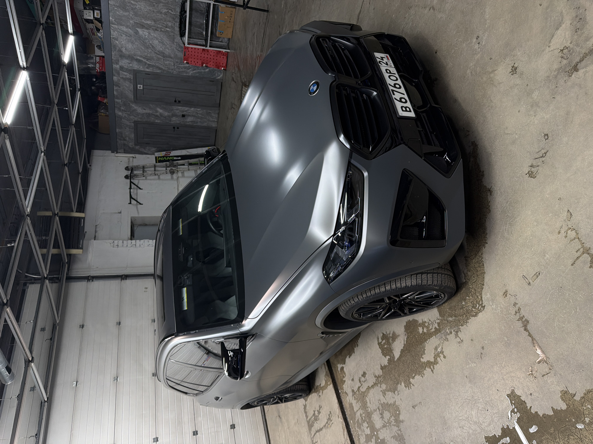 Car detailing facility busy with luxury vehicles in Krasnoyarsk