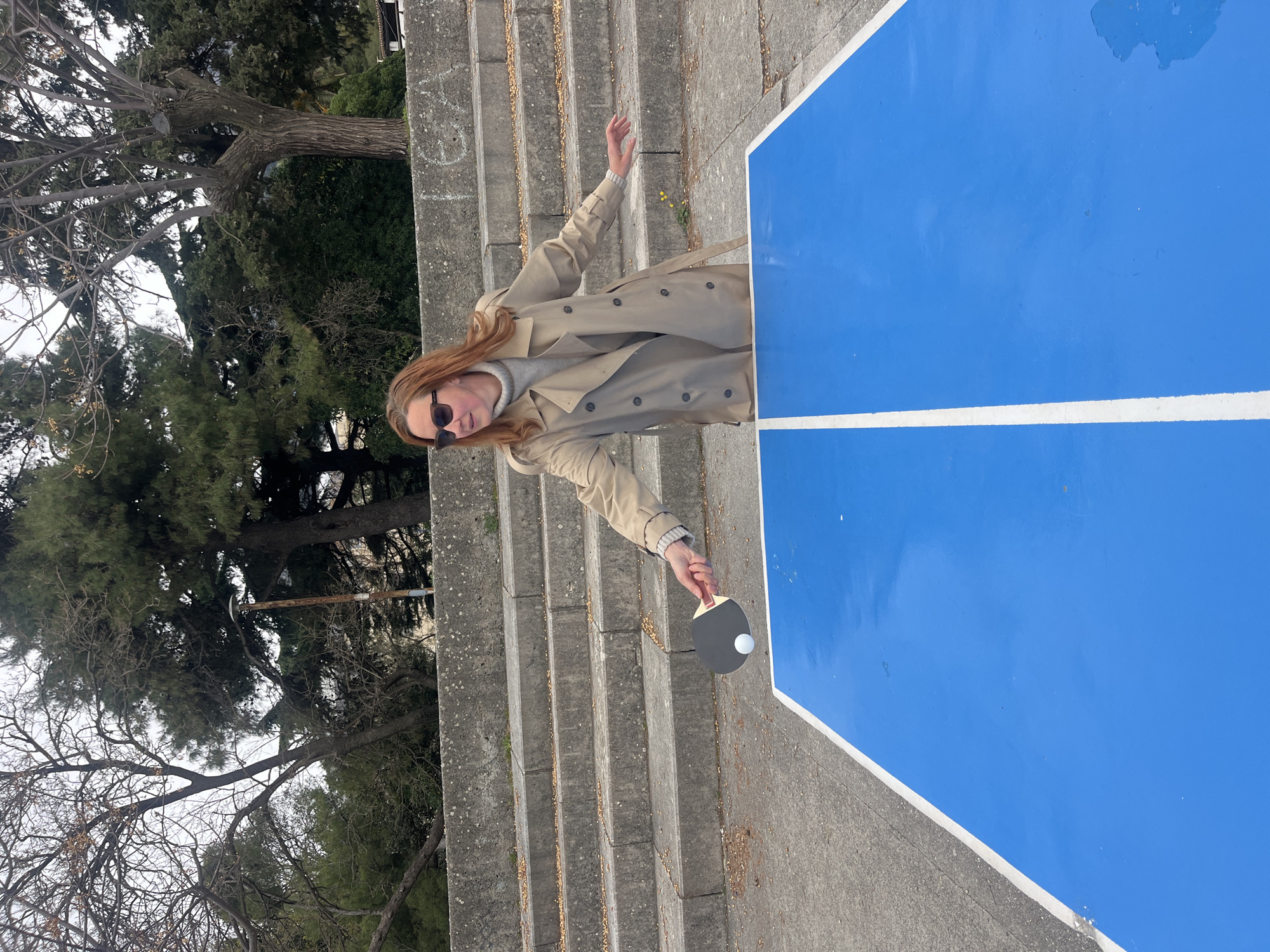 Woman plays outdoor ping pong in Budva Montenegro