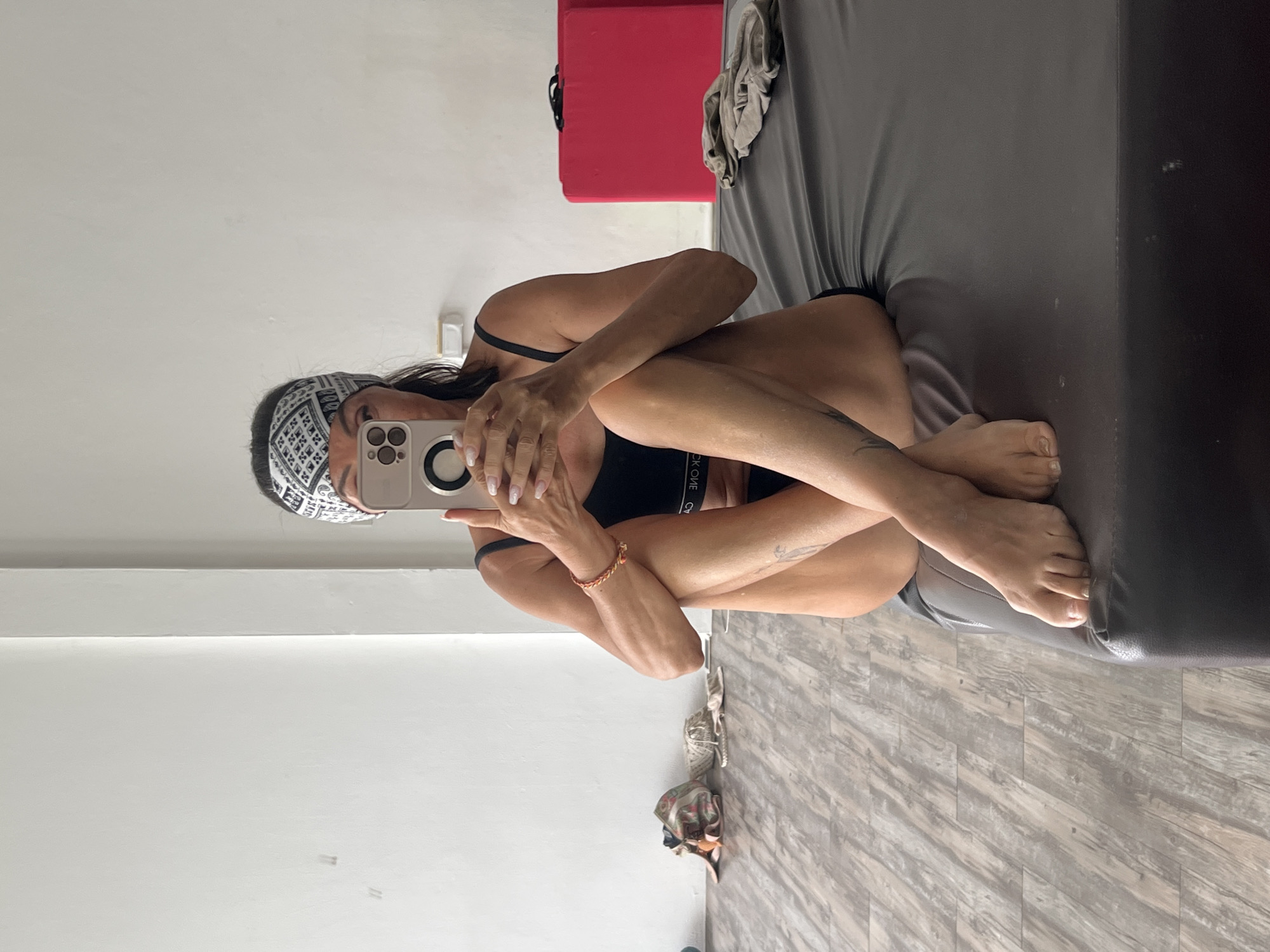 Woman takes morning selfies in bedroom in Thailand