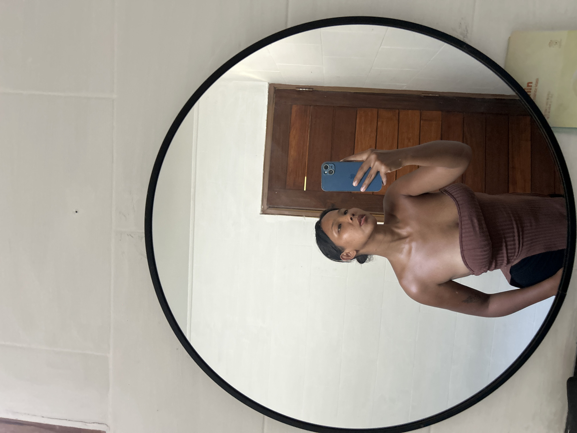 Mirror selfies and fresh fruit in a Kuta hotel room