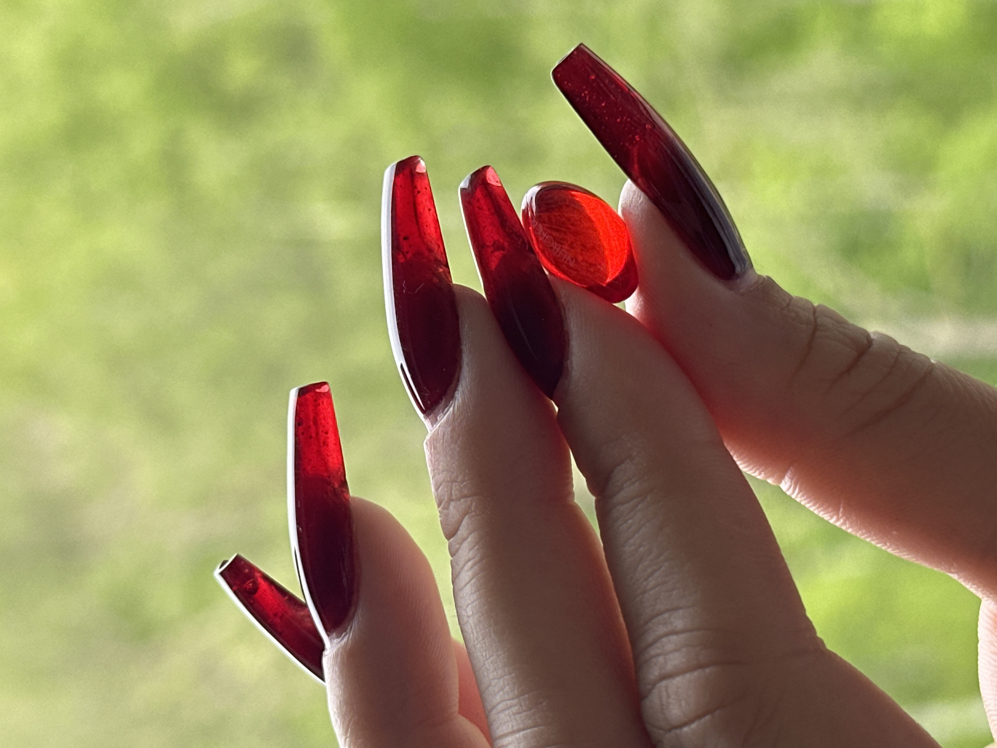 Red manicure photo session documented over two hours
