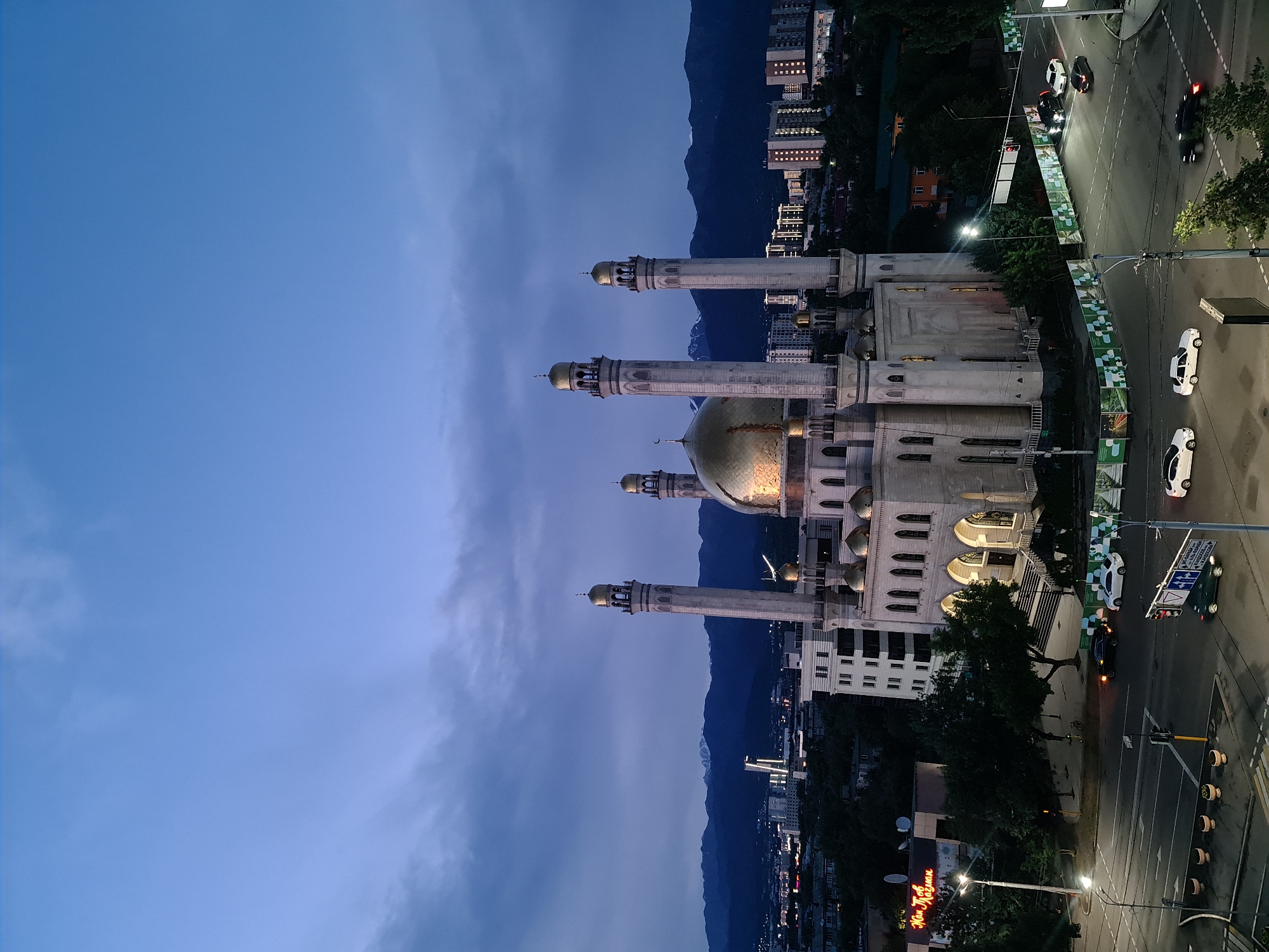 Almaty skyline and Central Mosque at golden hour dusk