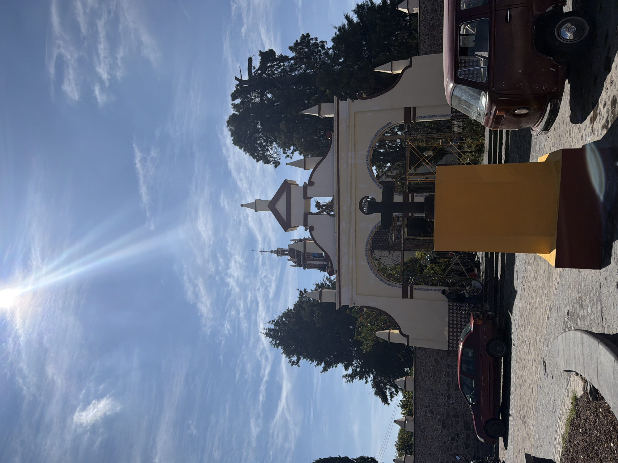 Colonial archway frames church tower in San Andrés Cholula