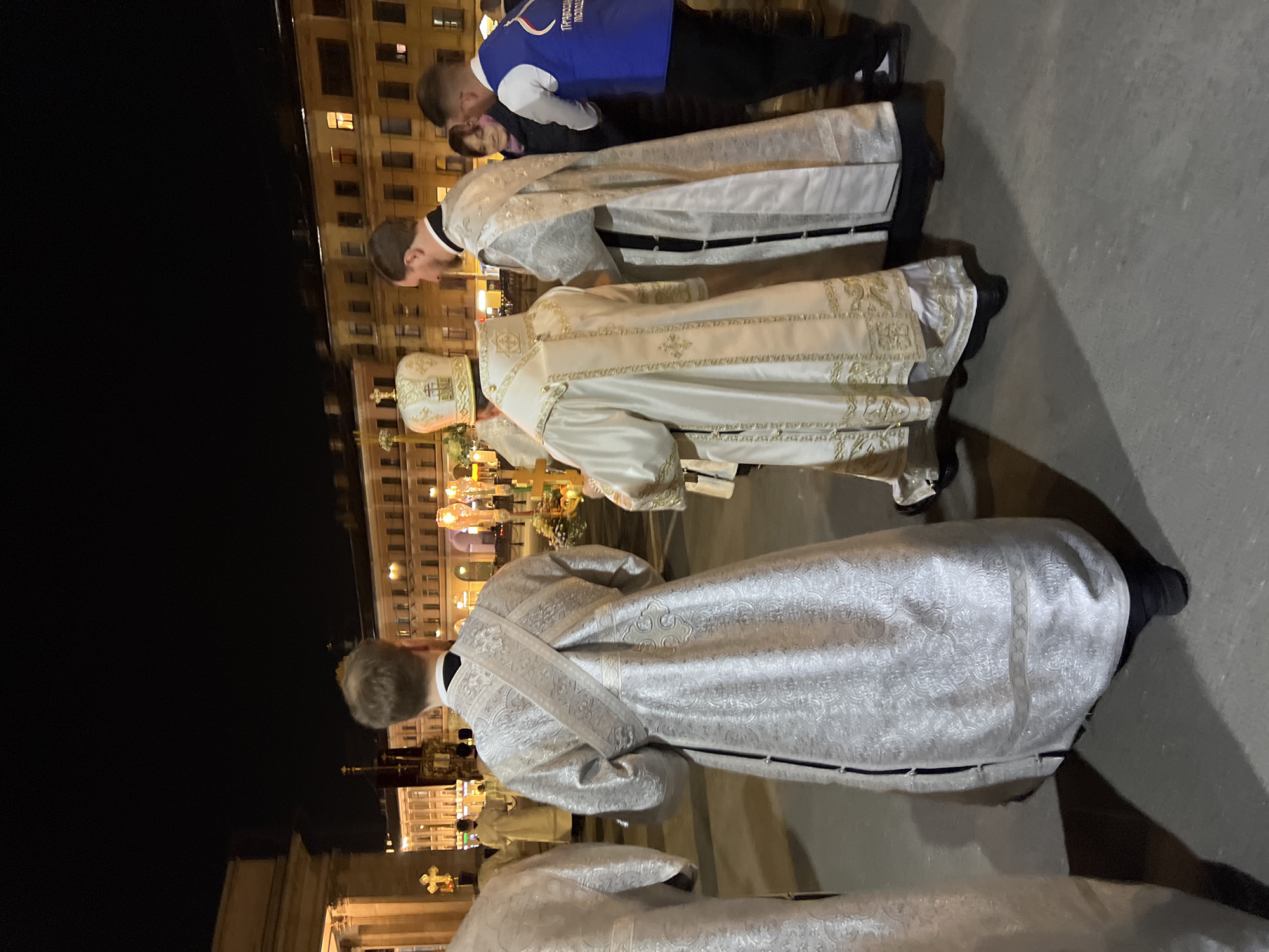 Nighttime religious procession with candles held in Saint Petersburg
