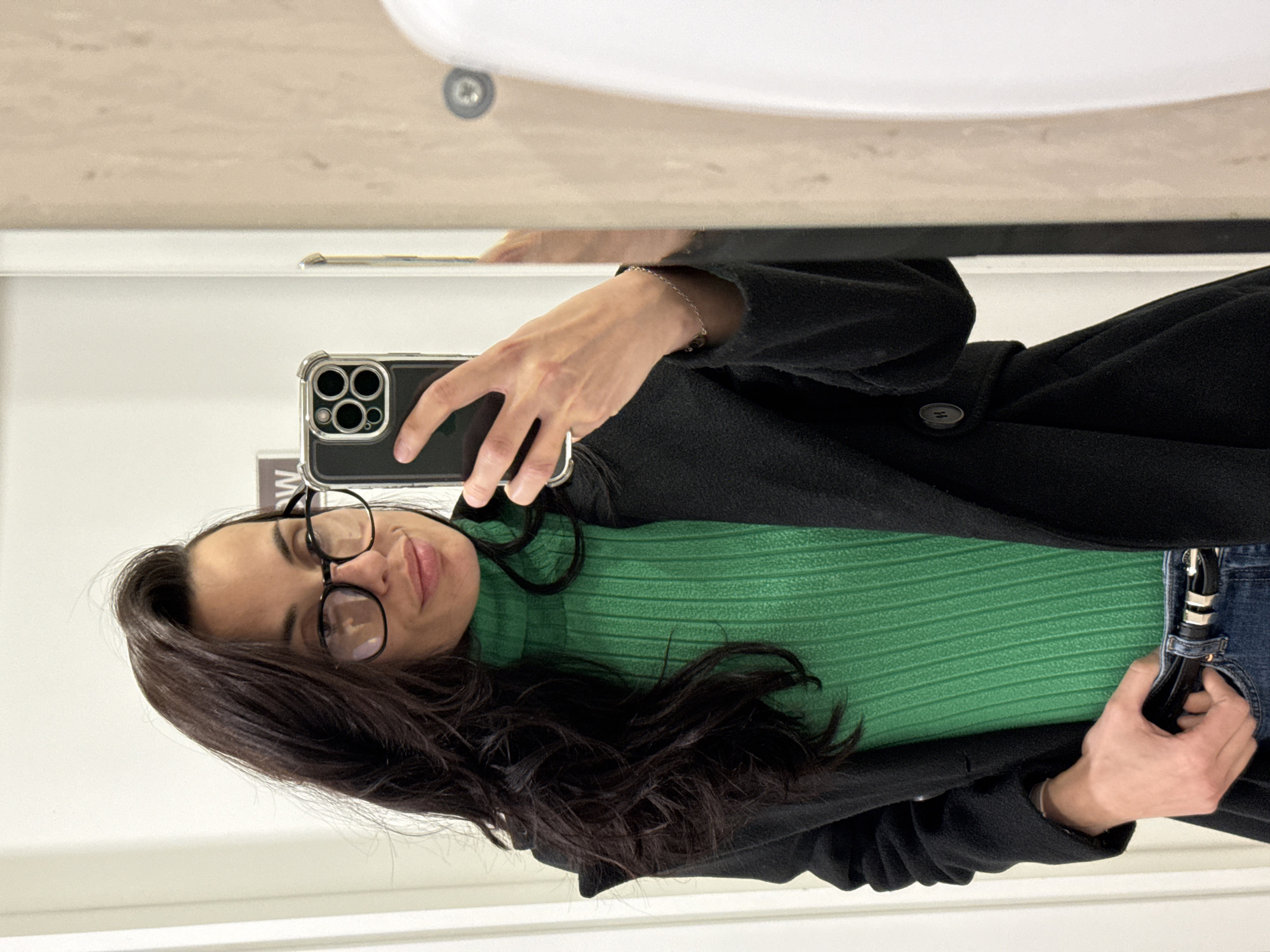 Woman takes selfie, winks at camera in Pleven bathroom