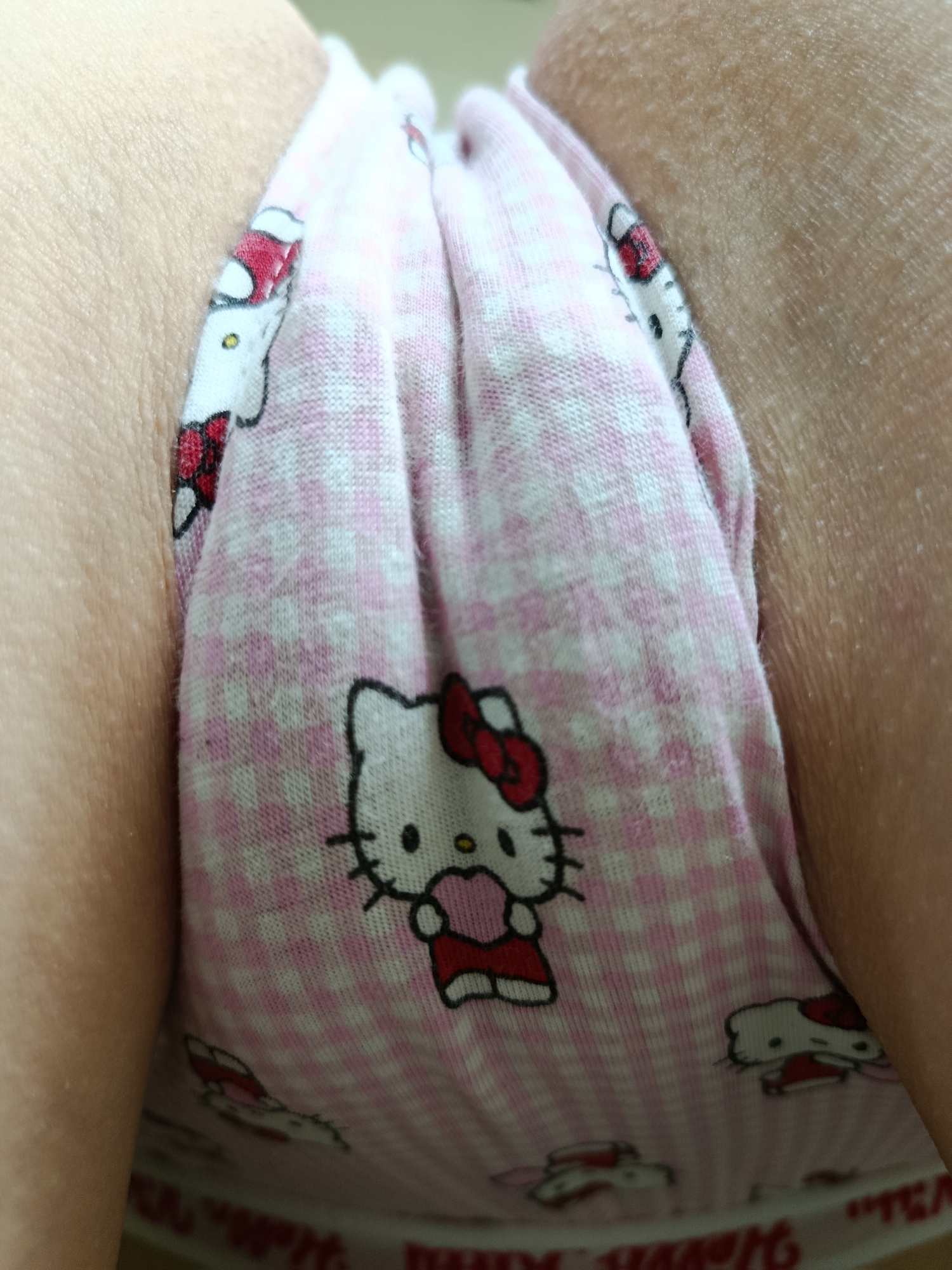 Individual photographed wearing Hello Kitty checkered underwear
