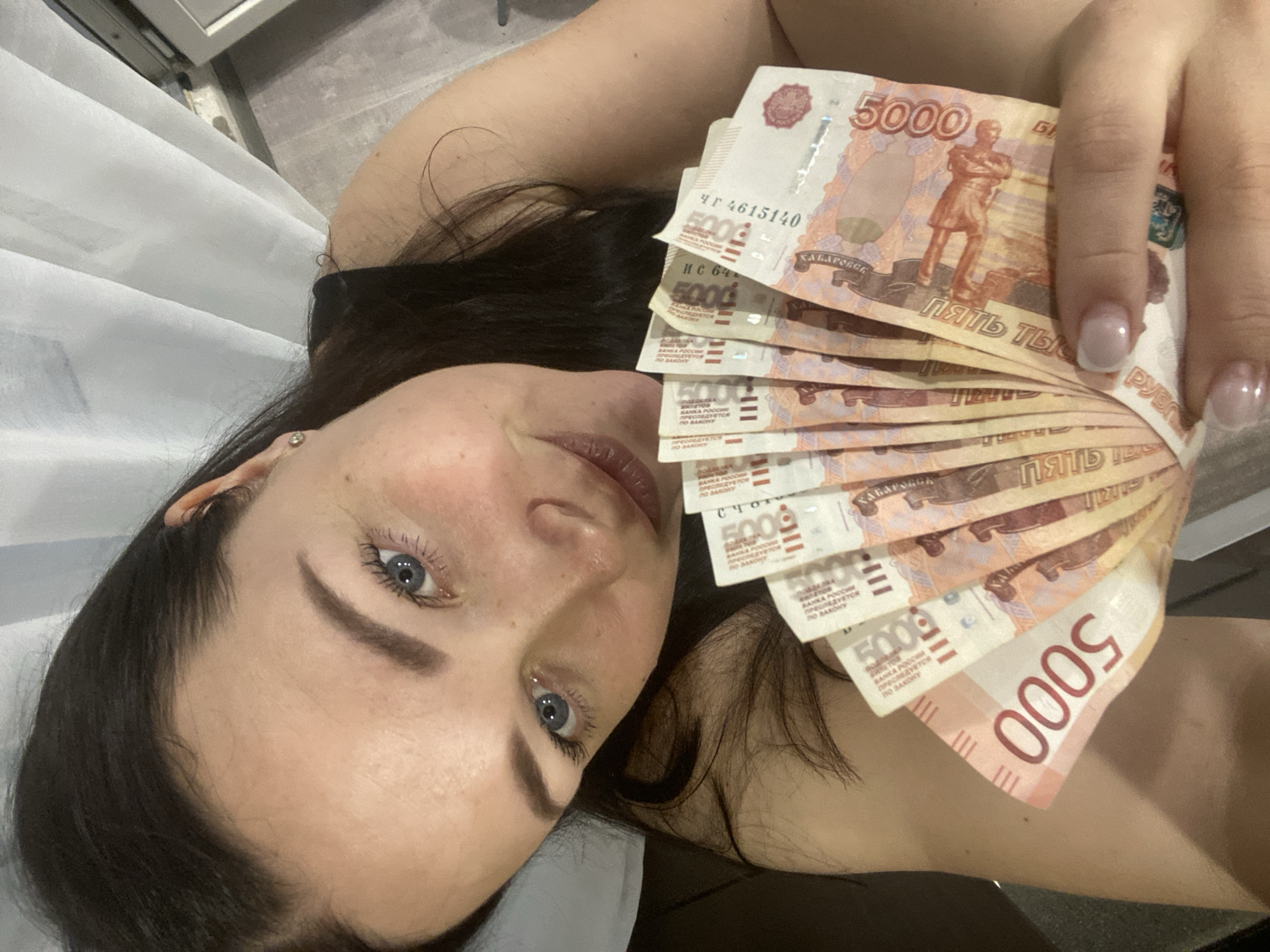 Woman photographed with Russian ruble banknotes in Sochi