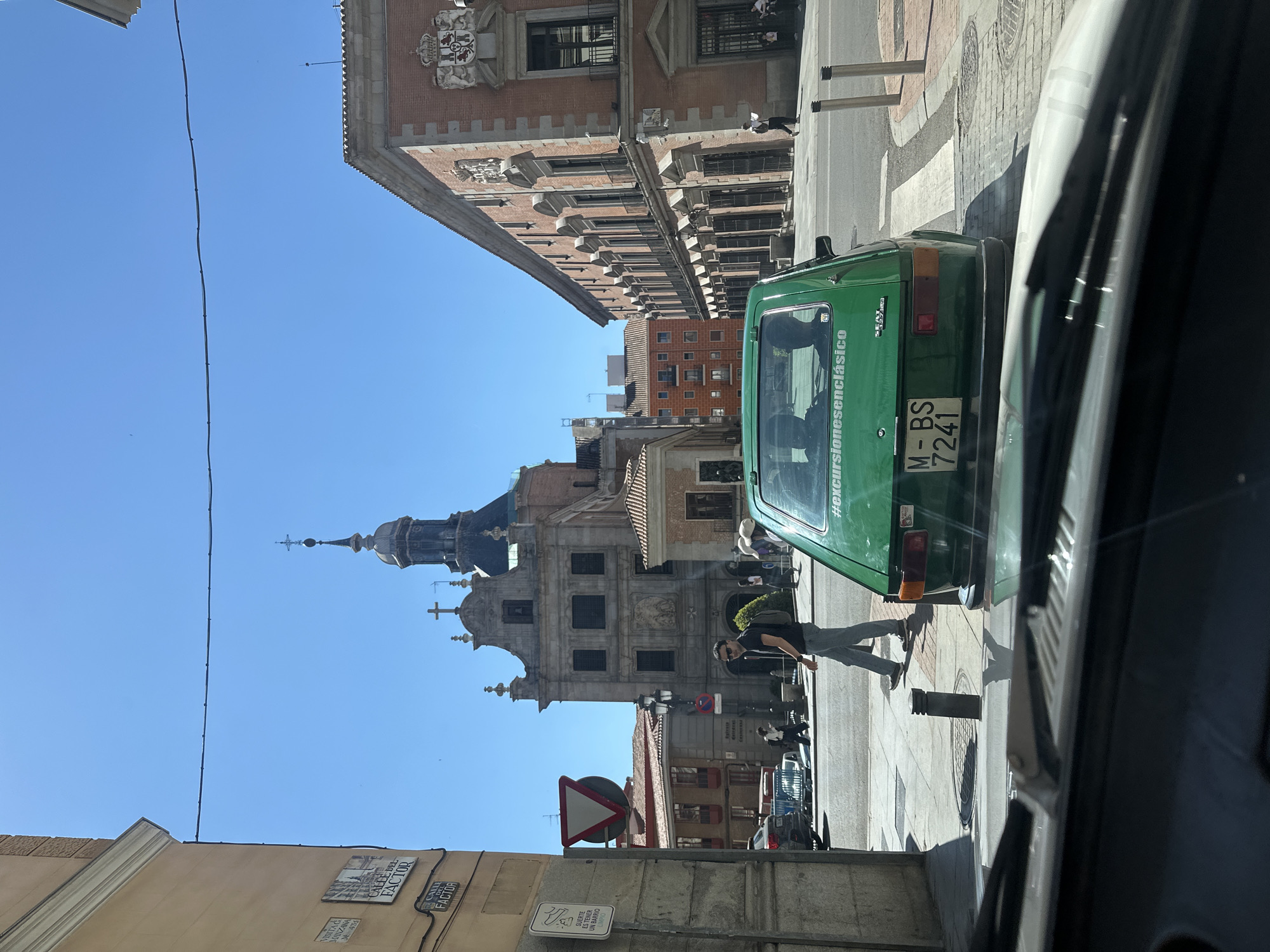 Tourist captures sunny Madrid drive past Almudena Cathedral