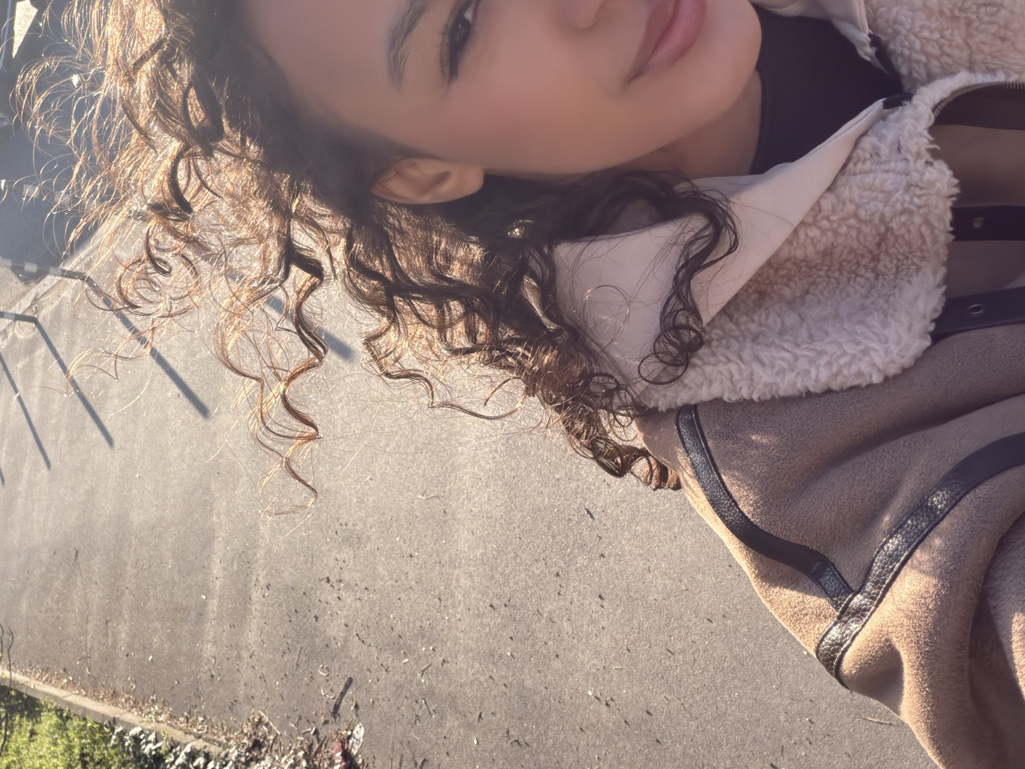 Woman takes selfie under daytime moon in Sofia