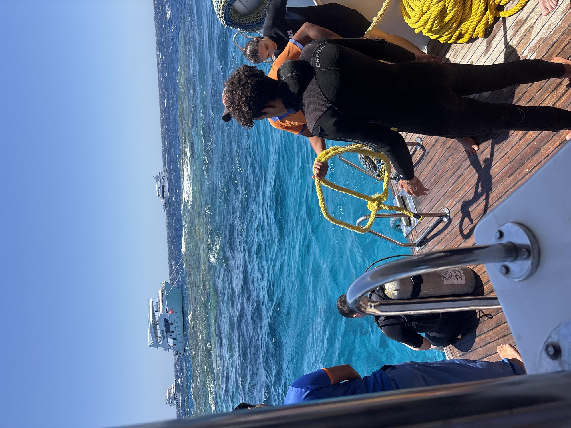 Scuba divers prepare for dive on boat in Egypt