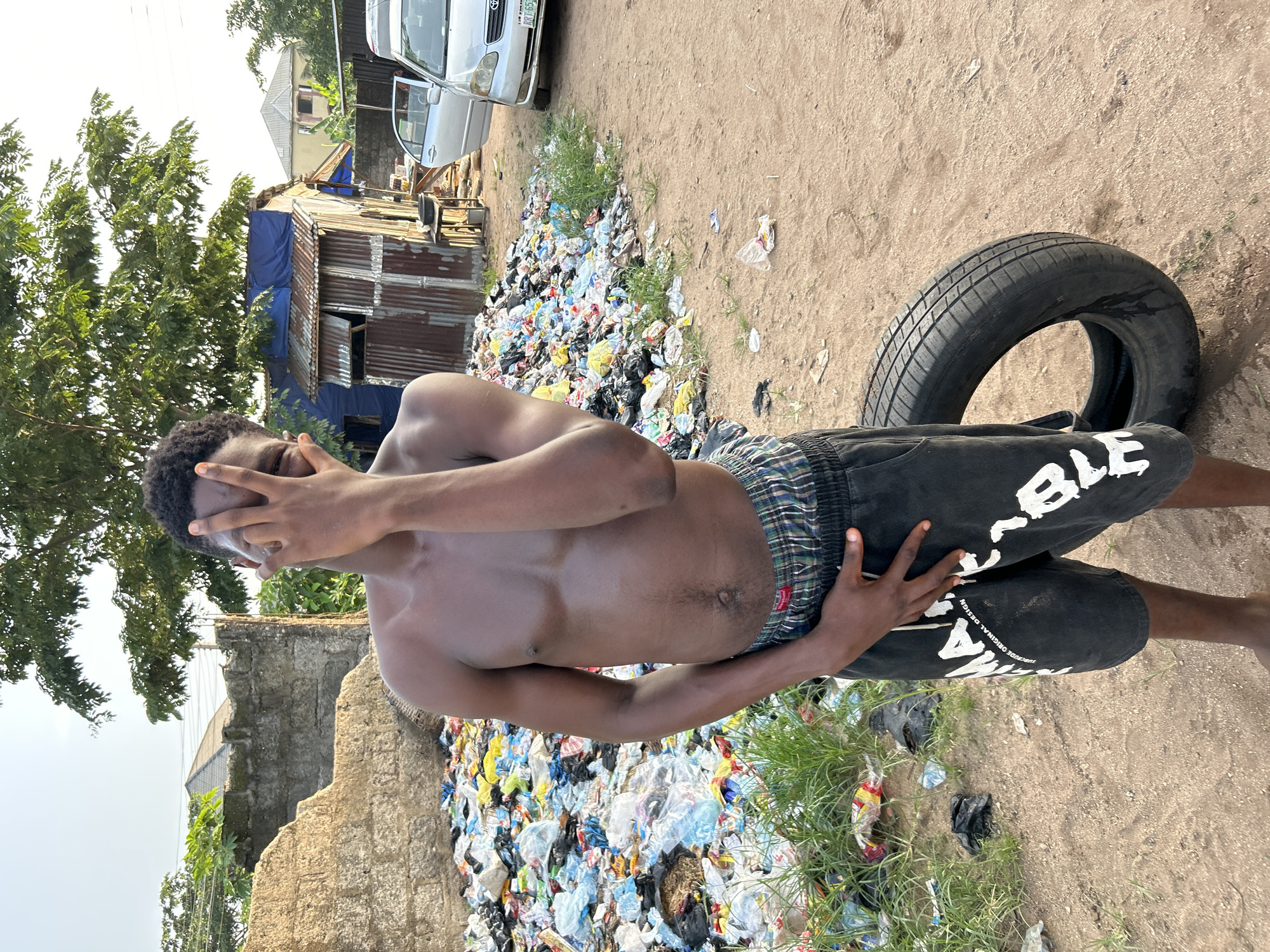 Young men photographed in outdoor settings in Ihiagwa, Nigeria