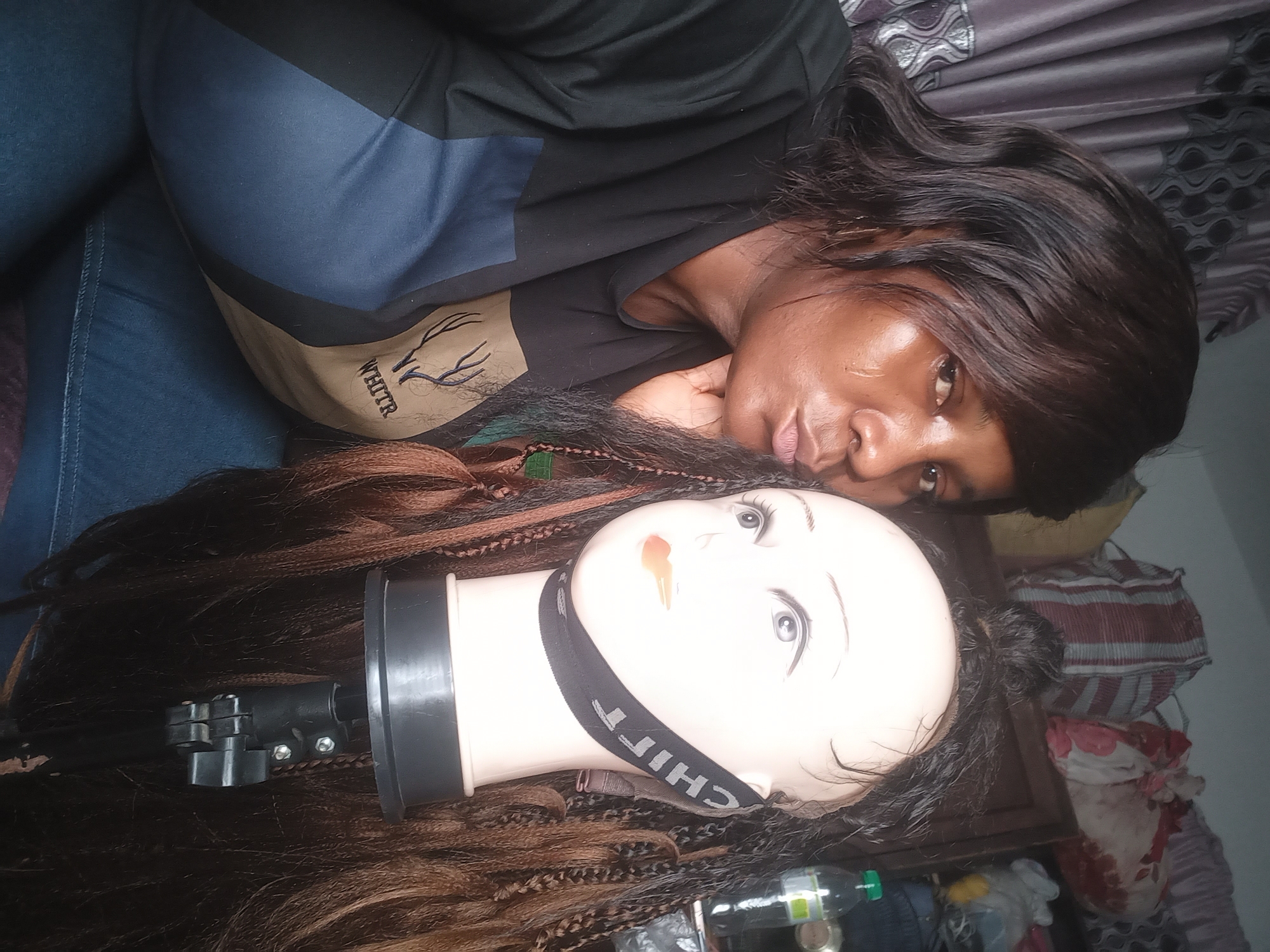 Woman documents hair styling session in Jos, Nigeria