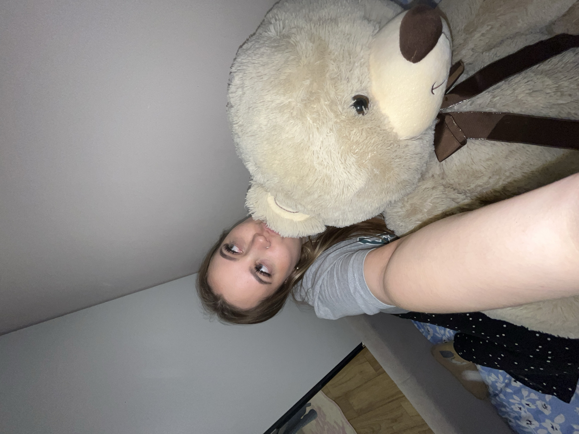 Woman poses with teddy bears in Krasnodar bedroom