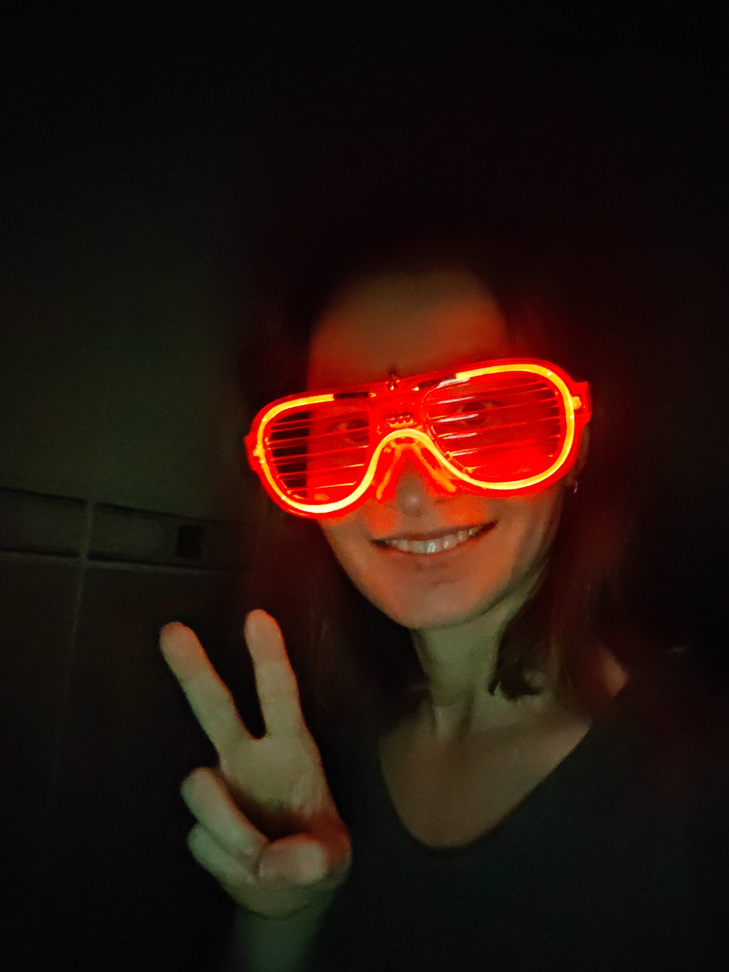Woman takes selfie with glowing glasses in Saint Petersburg