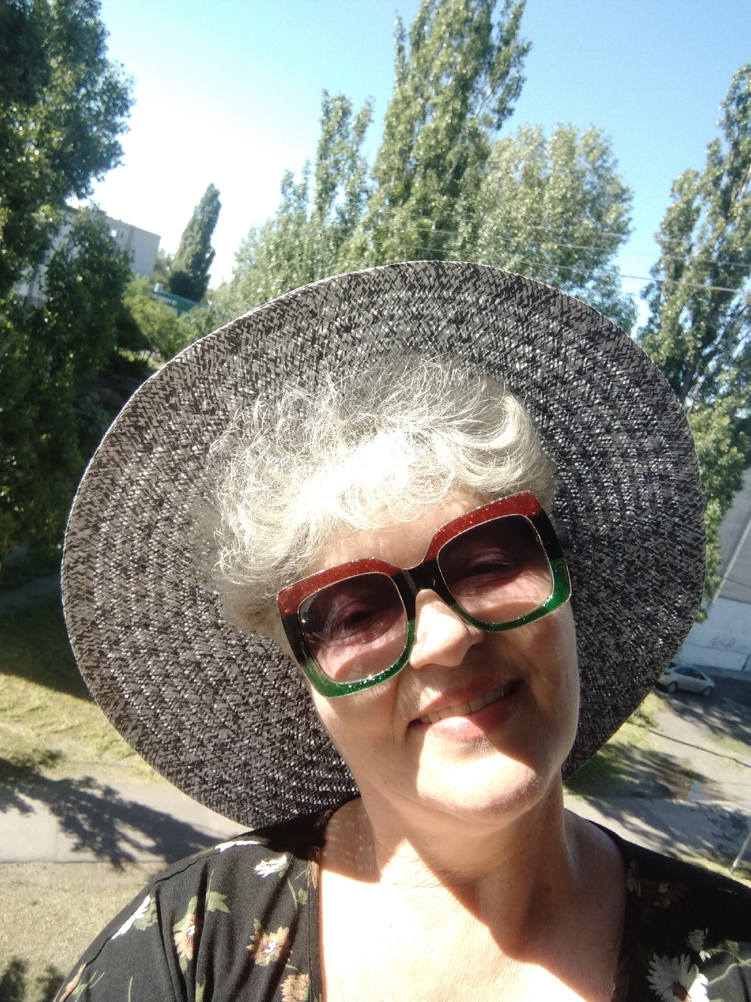 Woman takes selfies in bright morning sunlight in Ukraine
