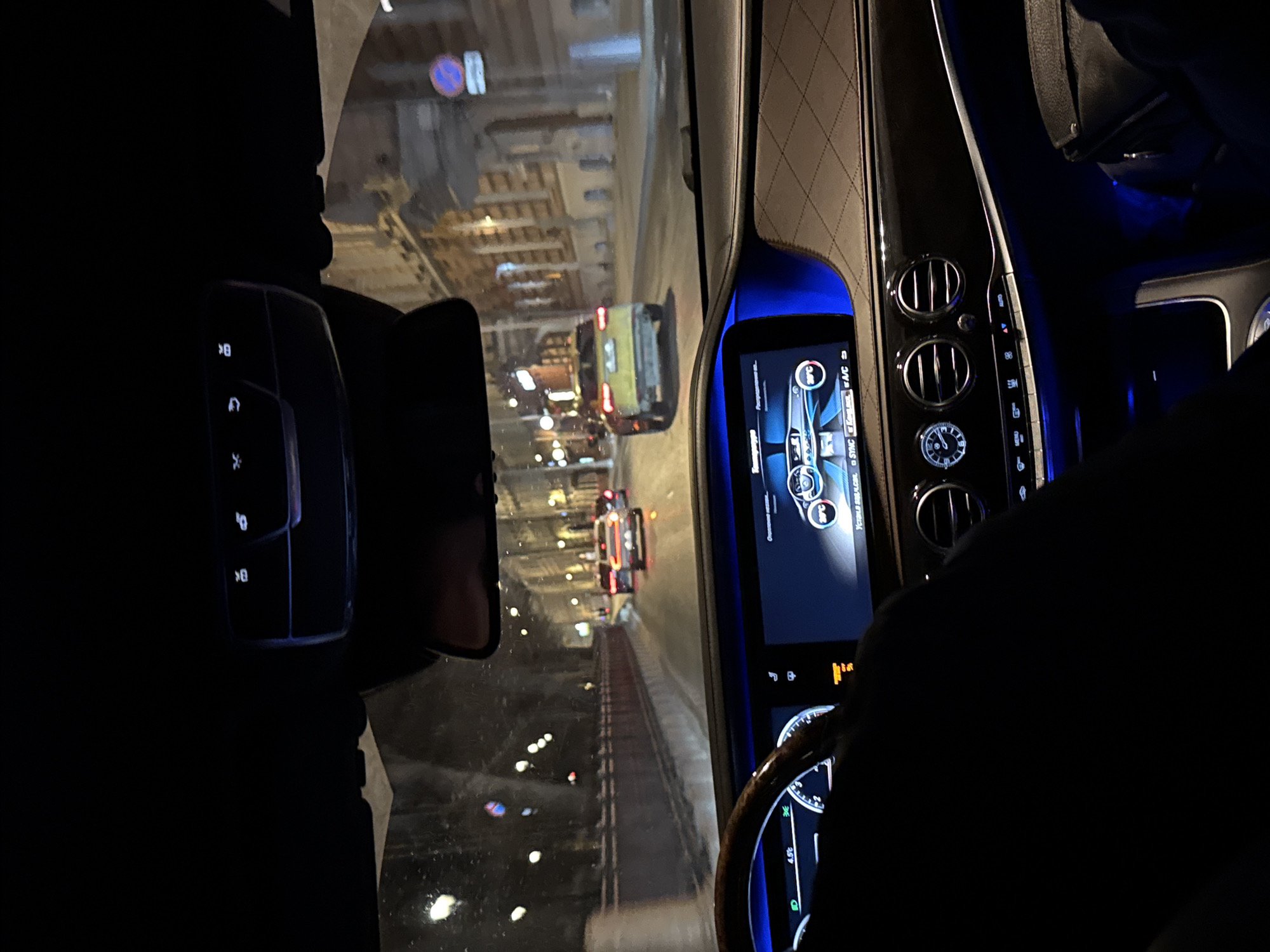 Night traffic observed in Moscow with yellow bus visible