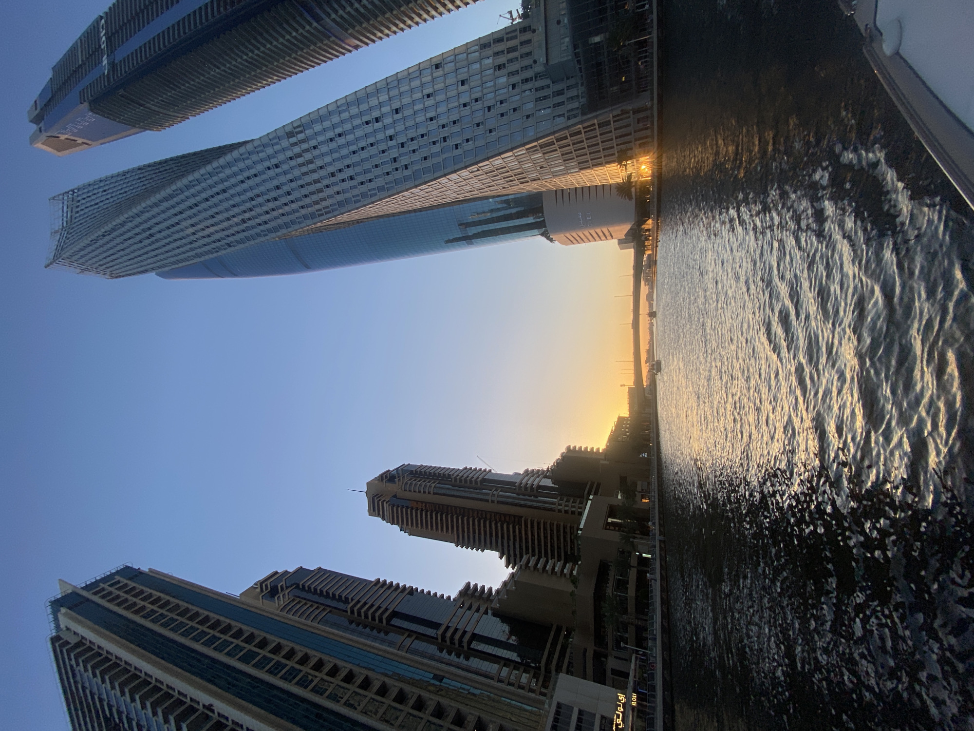 Dubai skyline with skyscrapers and water captured by witness
