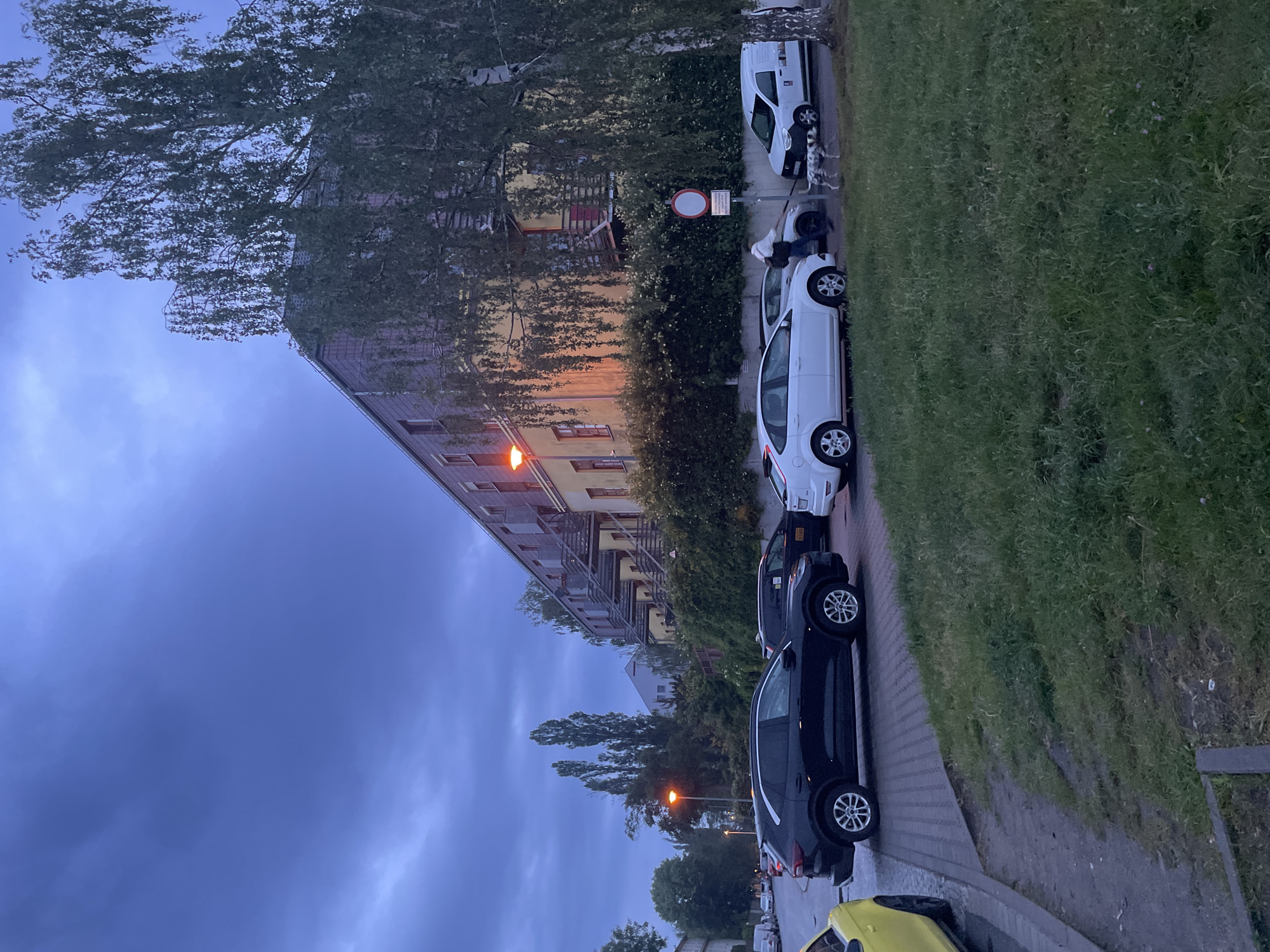 Evening street photography session documents overcast Wrocław neighborhoods