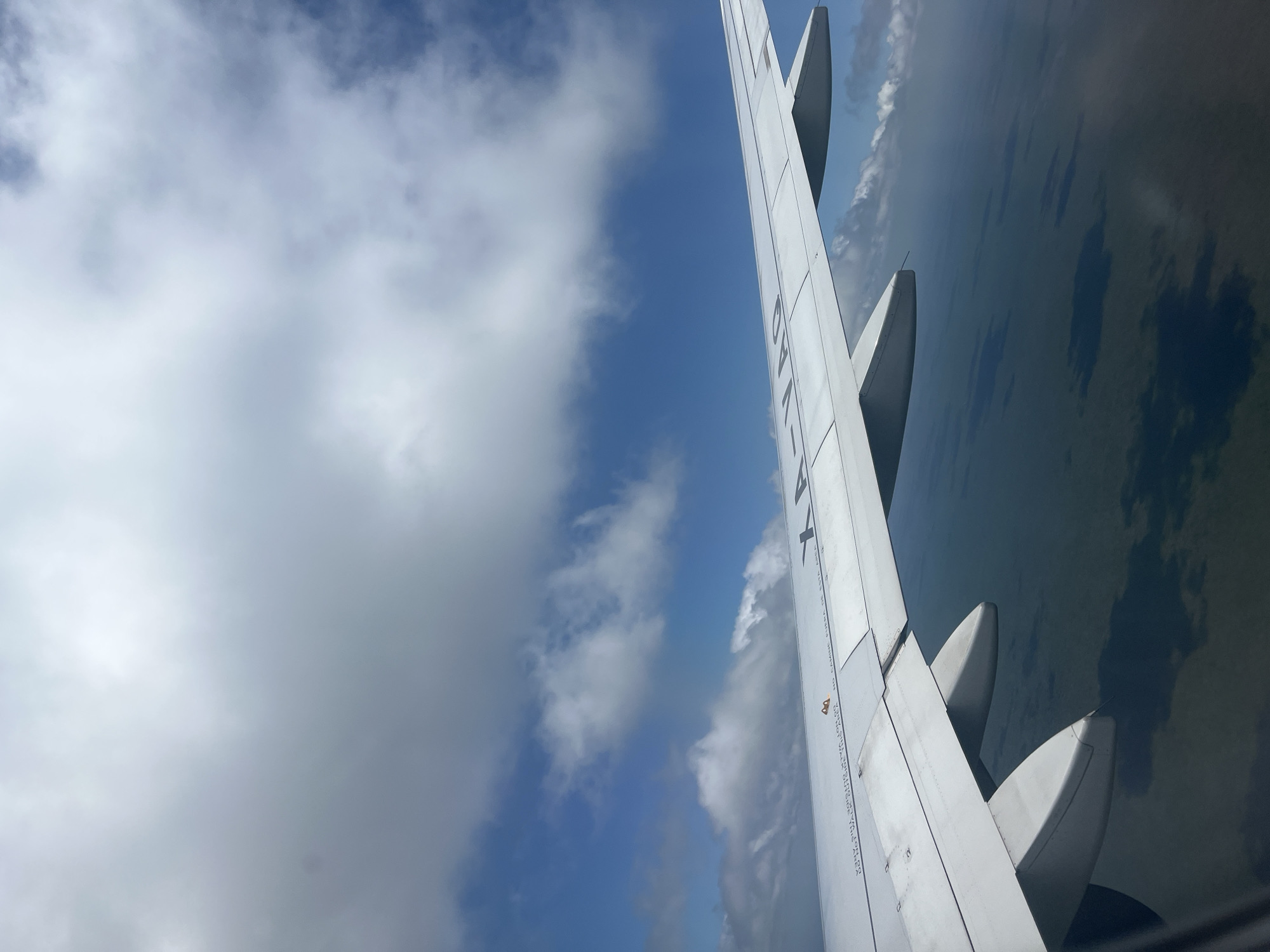 Aerial view captured from airplane window over Cancún
