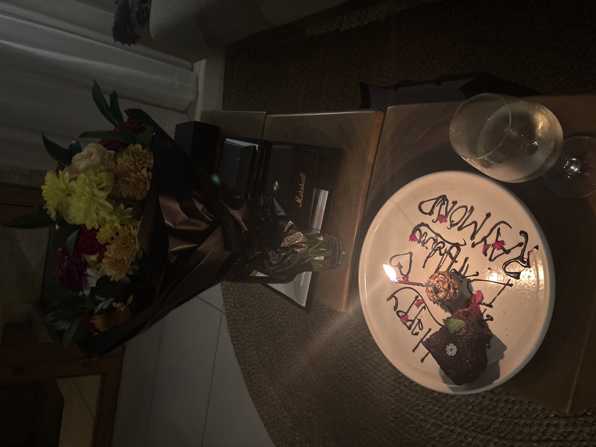 Flowers and Marshall speaker arranged indoors in Kuta Selatan