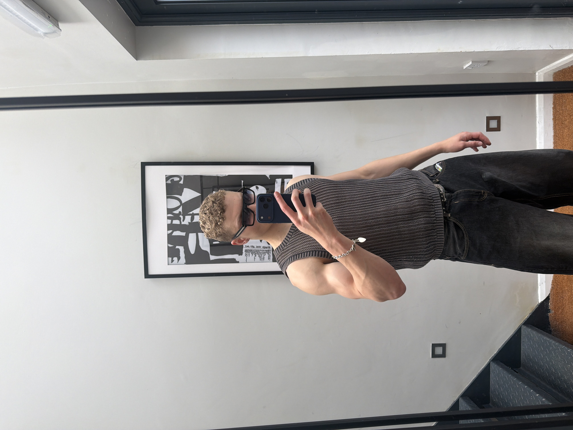 Person takes mirror selfie in London