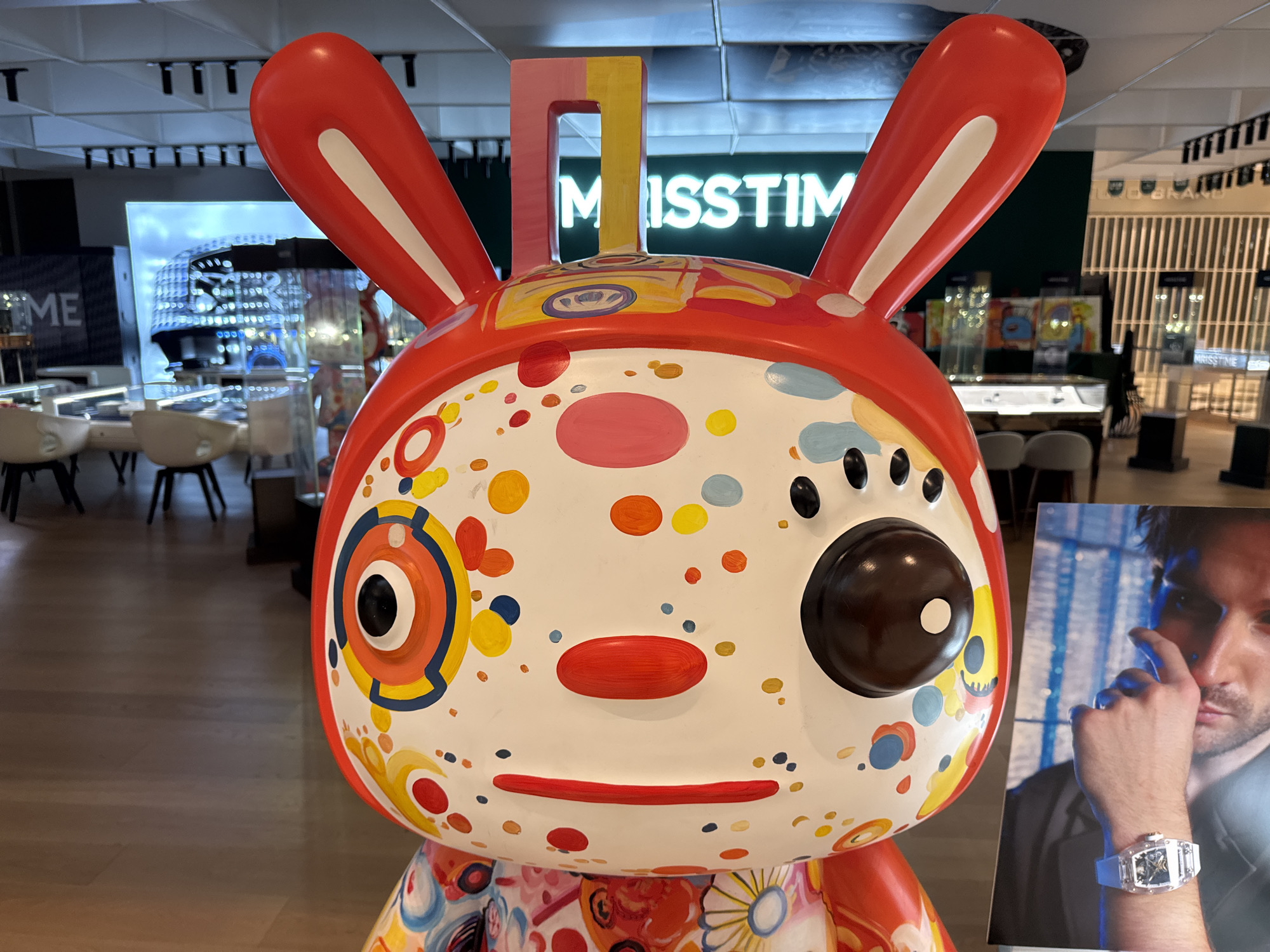 Shopper documents decorative displays at Macau mall