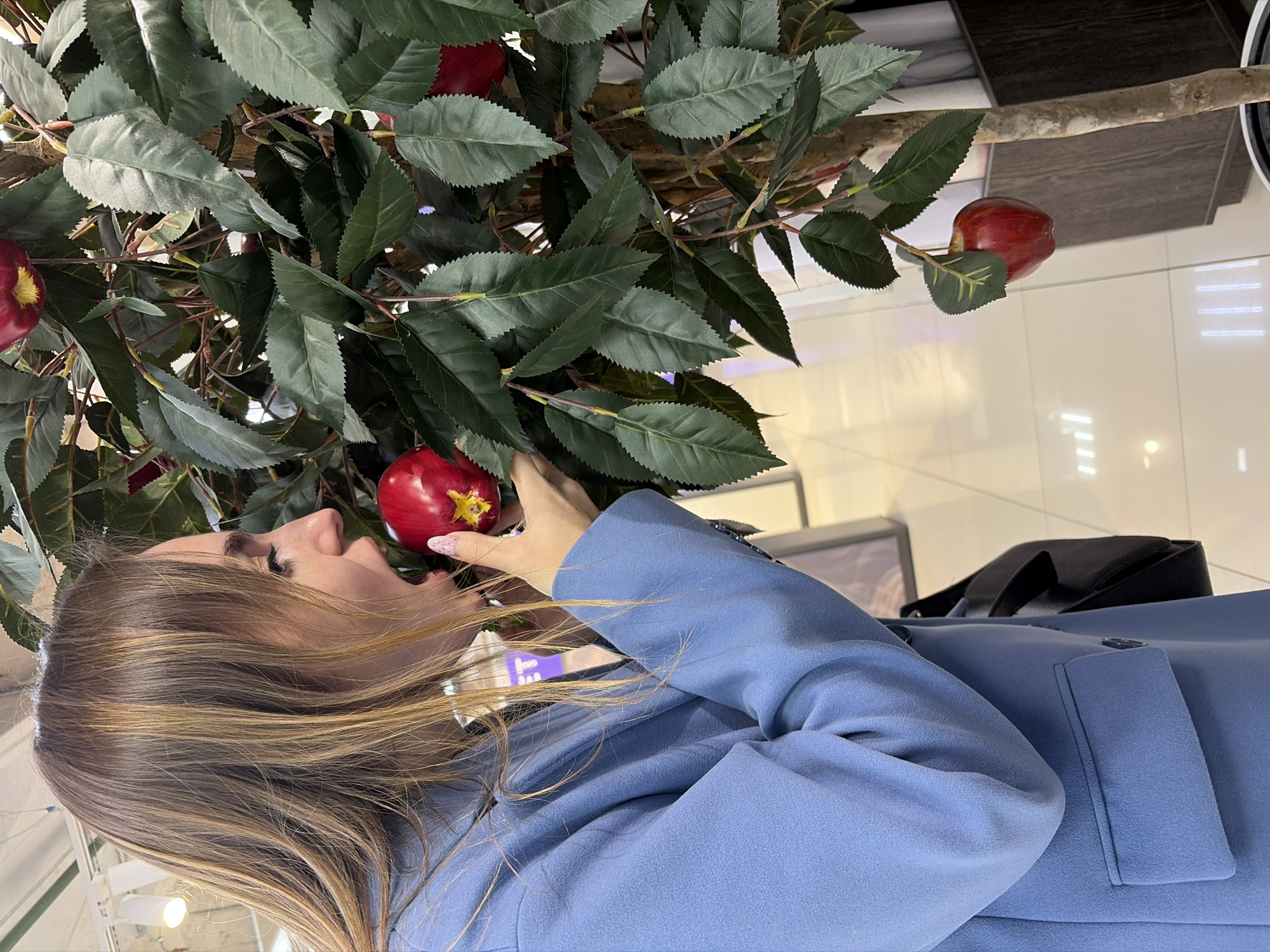 Woman attempts to bite artificial fruit in Izhevsk