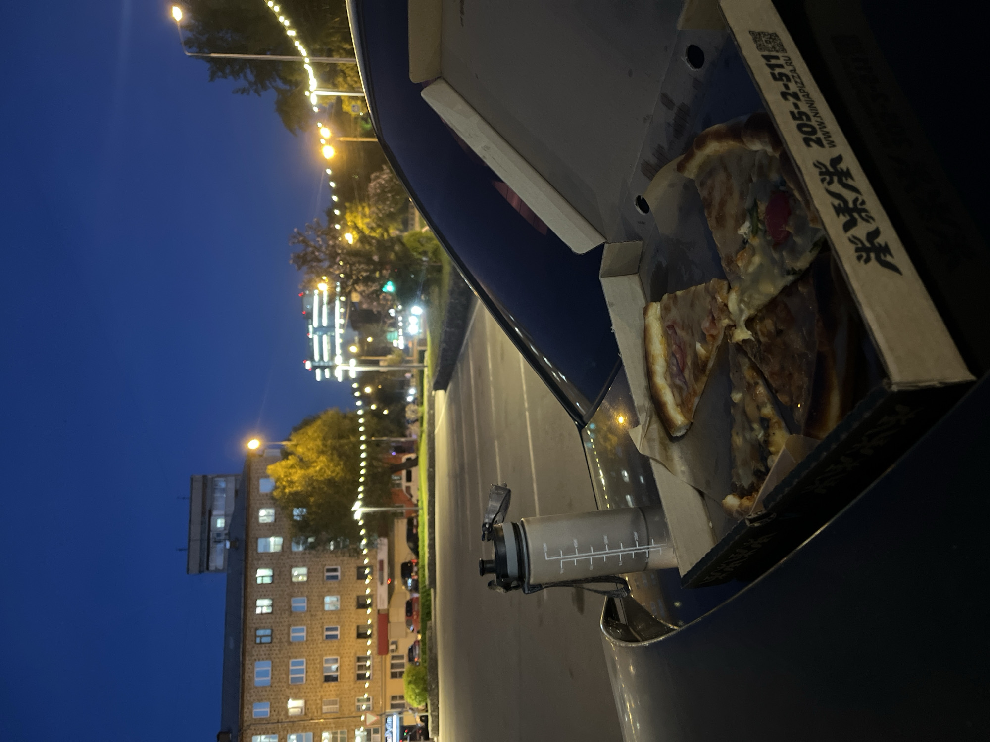 Pizza box photographed during evening hours in Krasnoyarsk