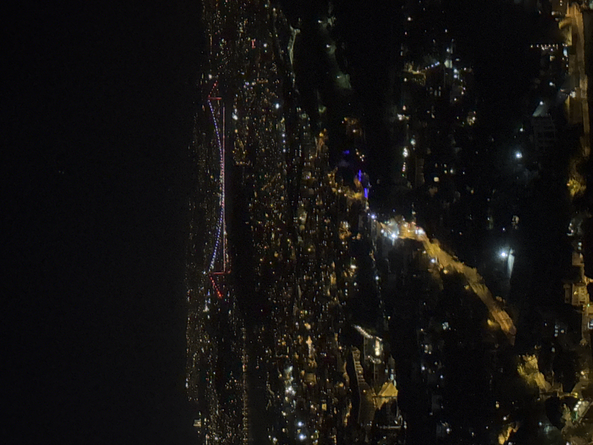 Nighttime aerial views capture illuminated Üsküdar and Bosphorus Bridge