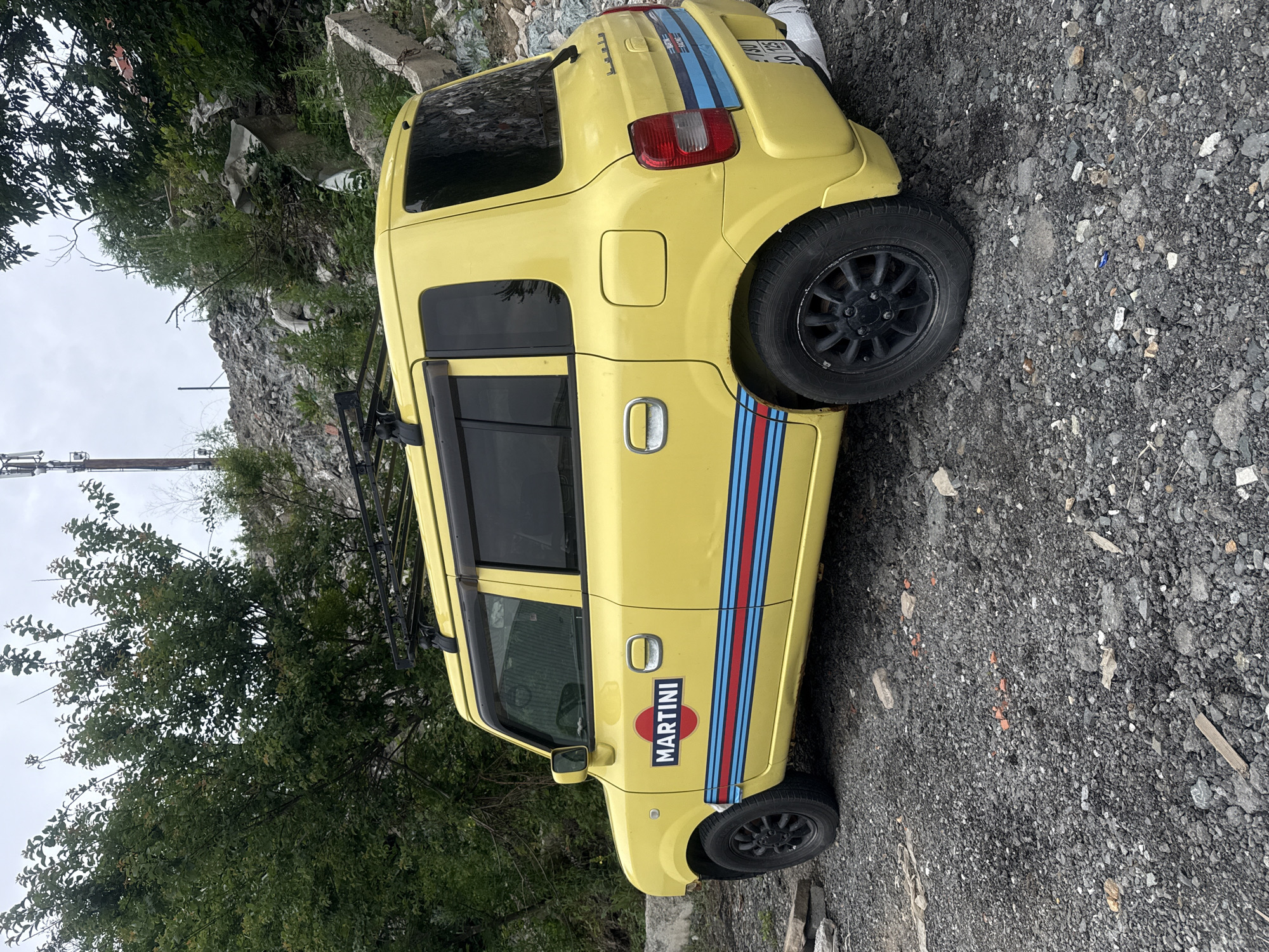 Yellow hatchback with Martini Racing livery parked in Vladivostok
