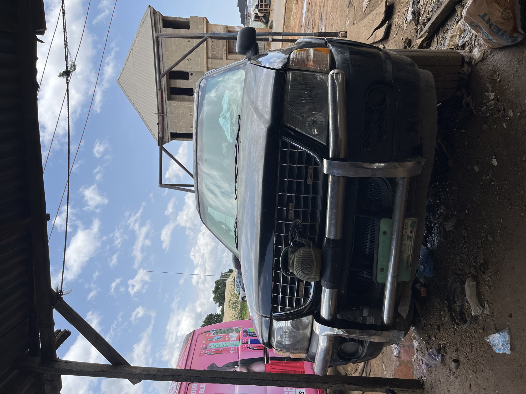 Auto workshop and scrapyard activity in Rafin Par, Nigeria