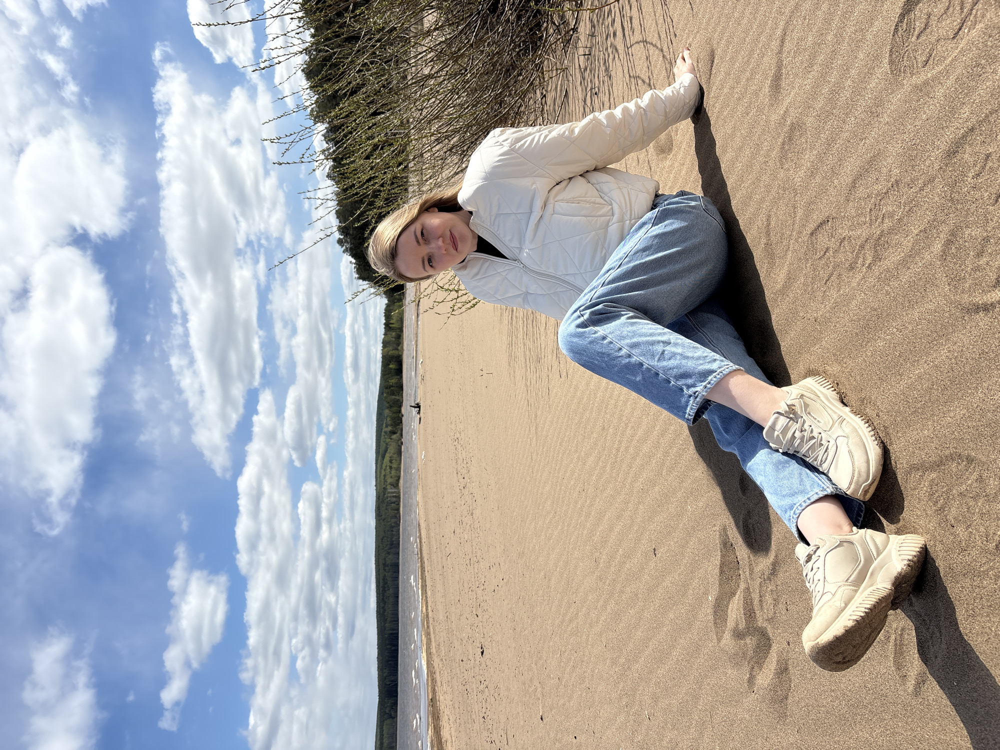 Woman enjoys morning beach time in Chaikovsky, Russia