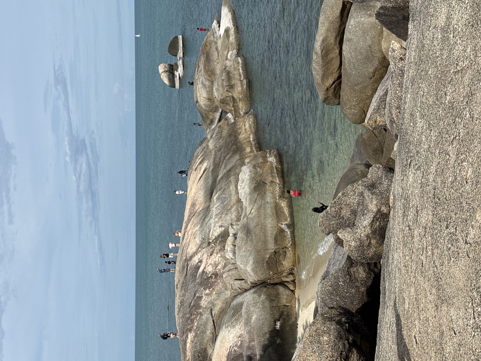Morning hangout on the boulder-strewn shore of Baan Hua Thanon