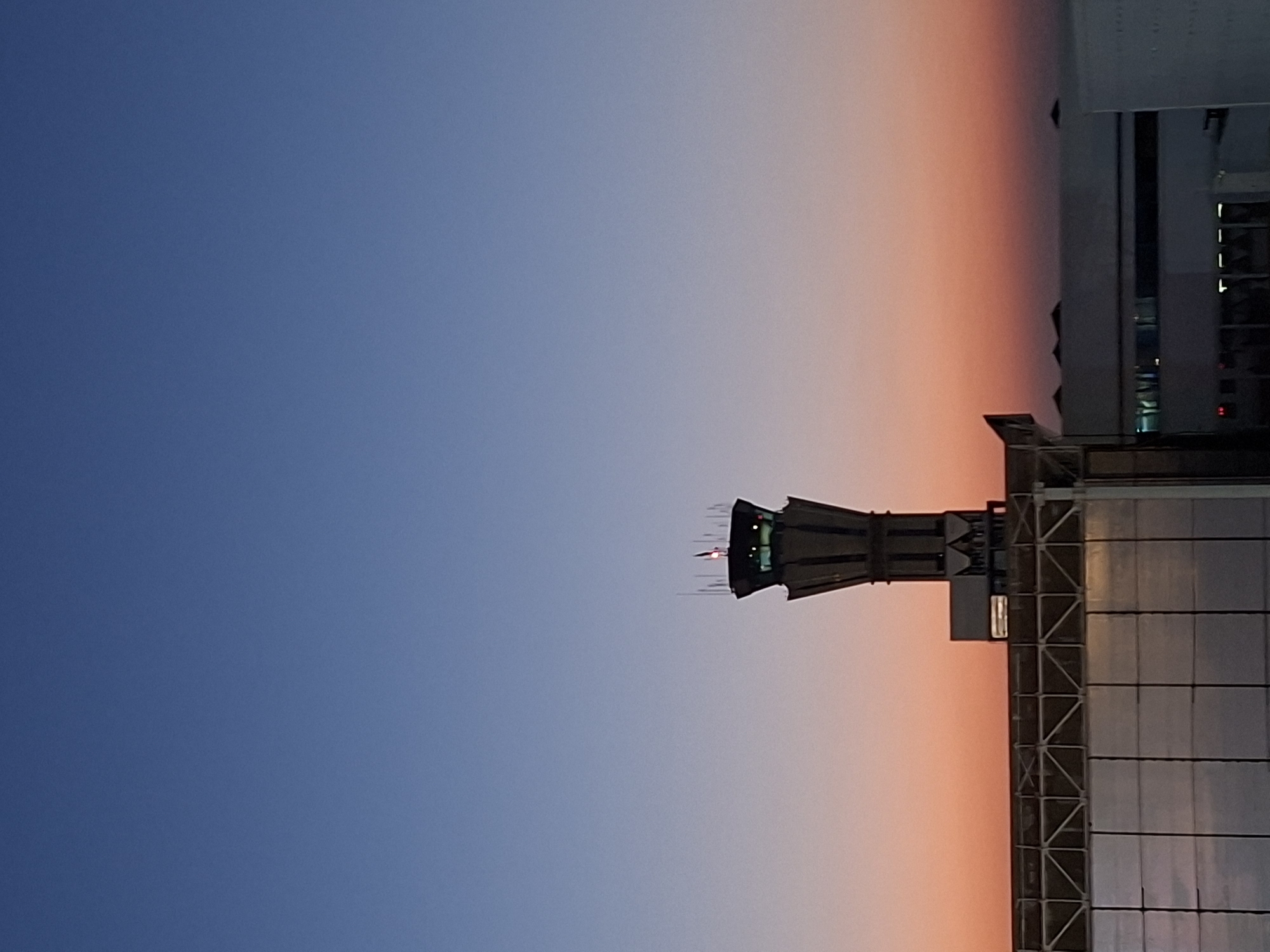 Tashkent Airport control tower at dusk, July 2026