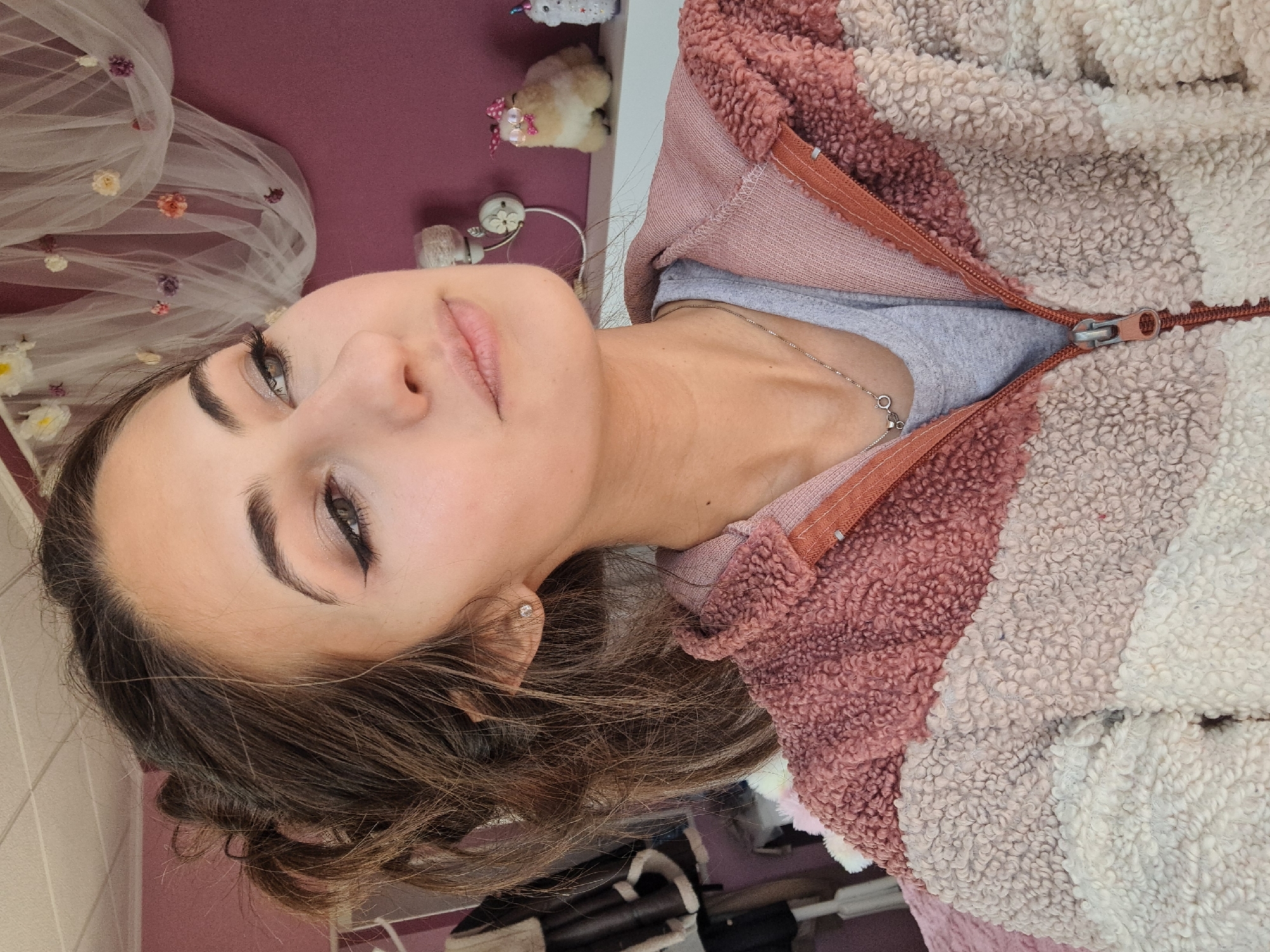 Woman applies makeup in Chepintsi, Bulgaria morning routine