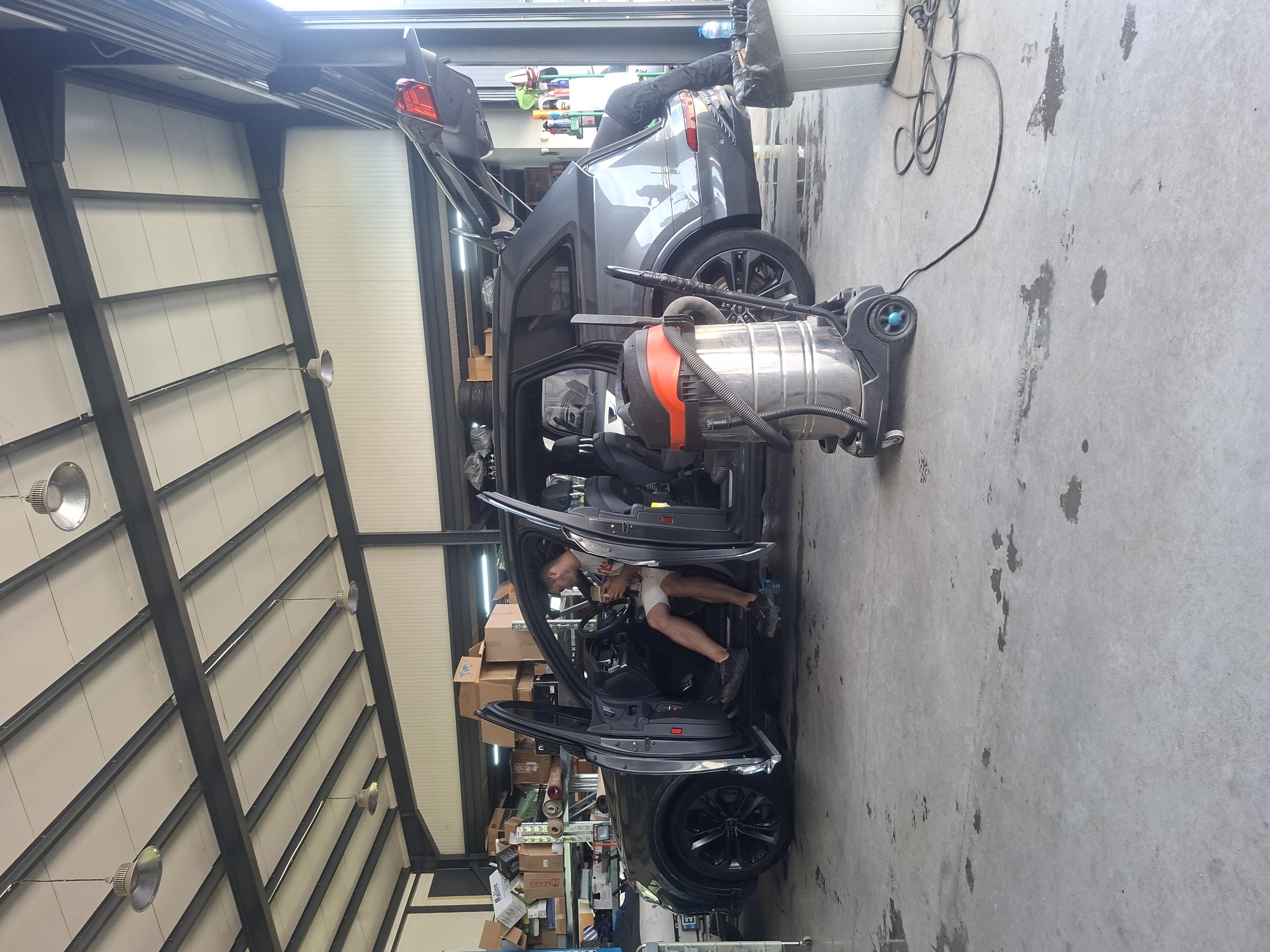 SUV with open doors spotted at automotive shop