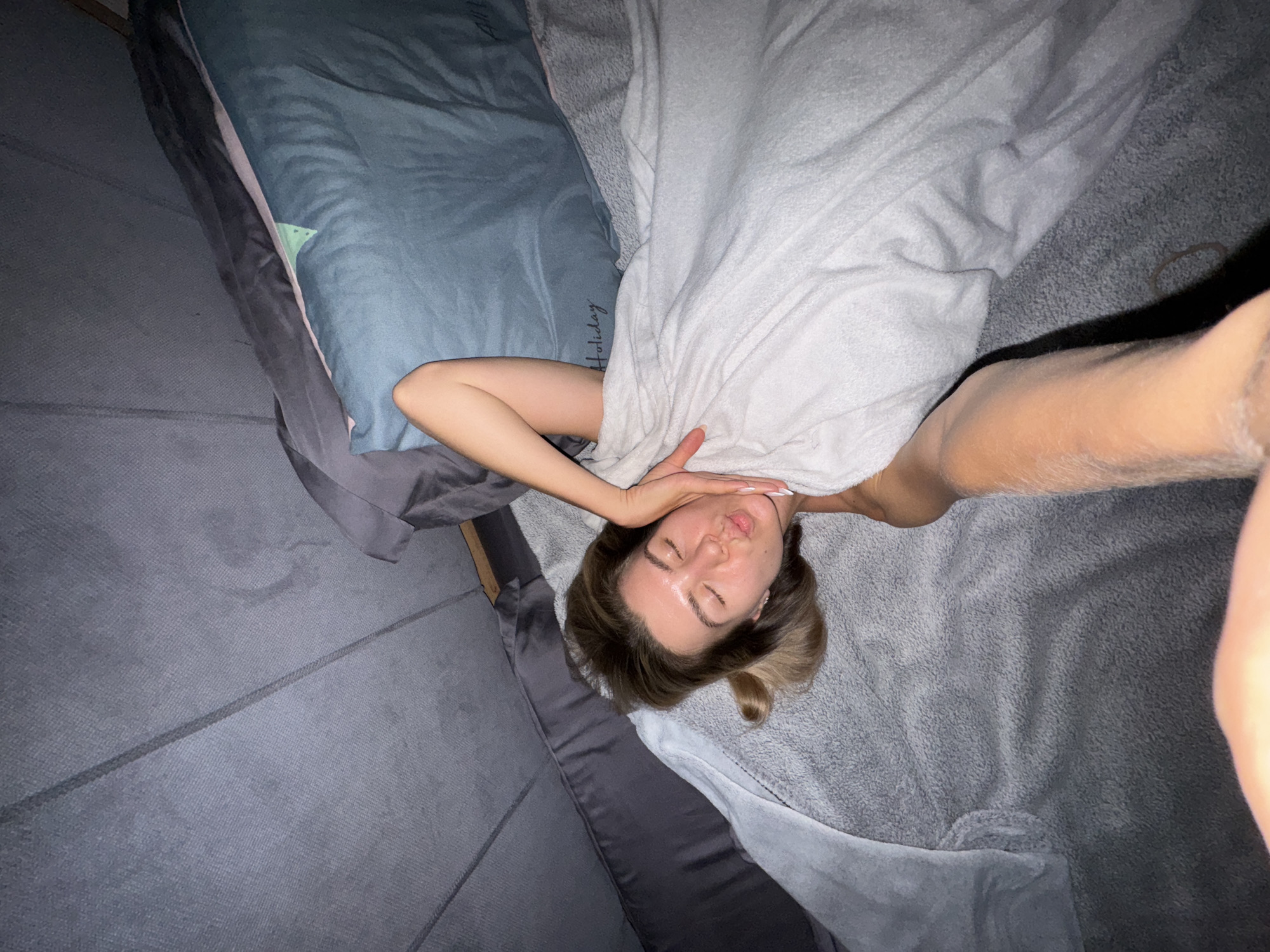 Evening domestic scenes: woman resting, cats sleeping, city dusk
