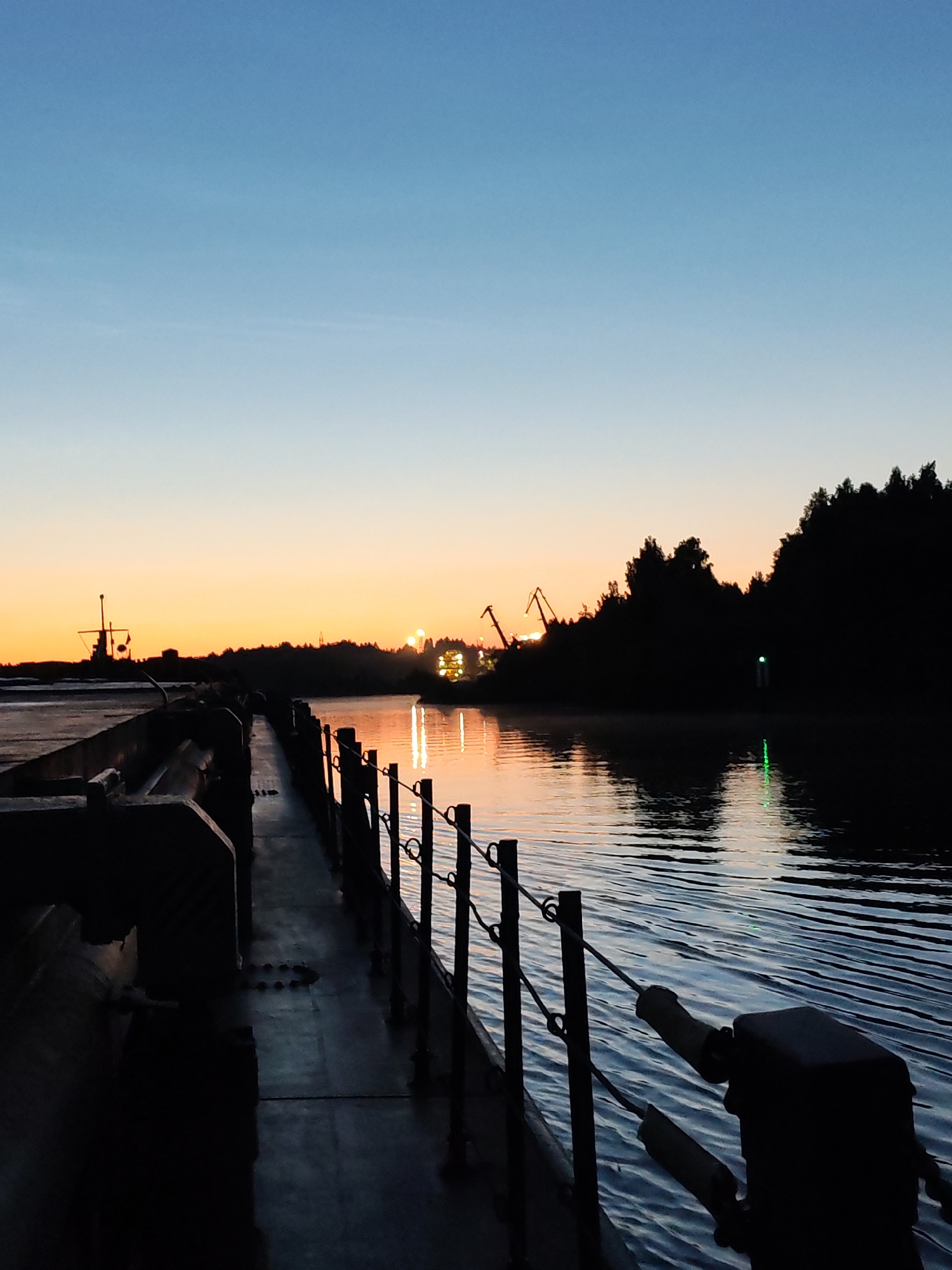 Dock and river at dusk, Annenskii Most