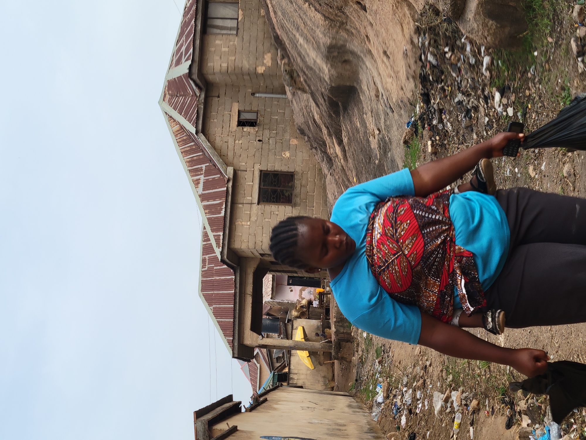 Daily life unfolds on dusty streets in Jos, Nigeria