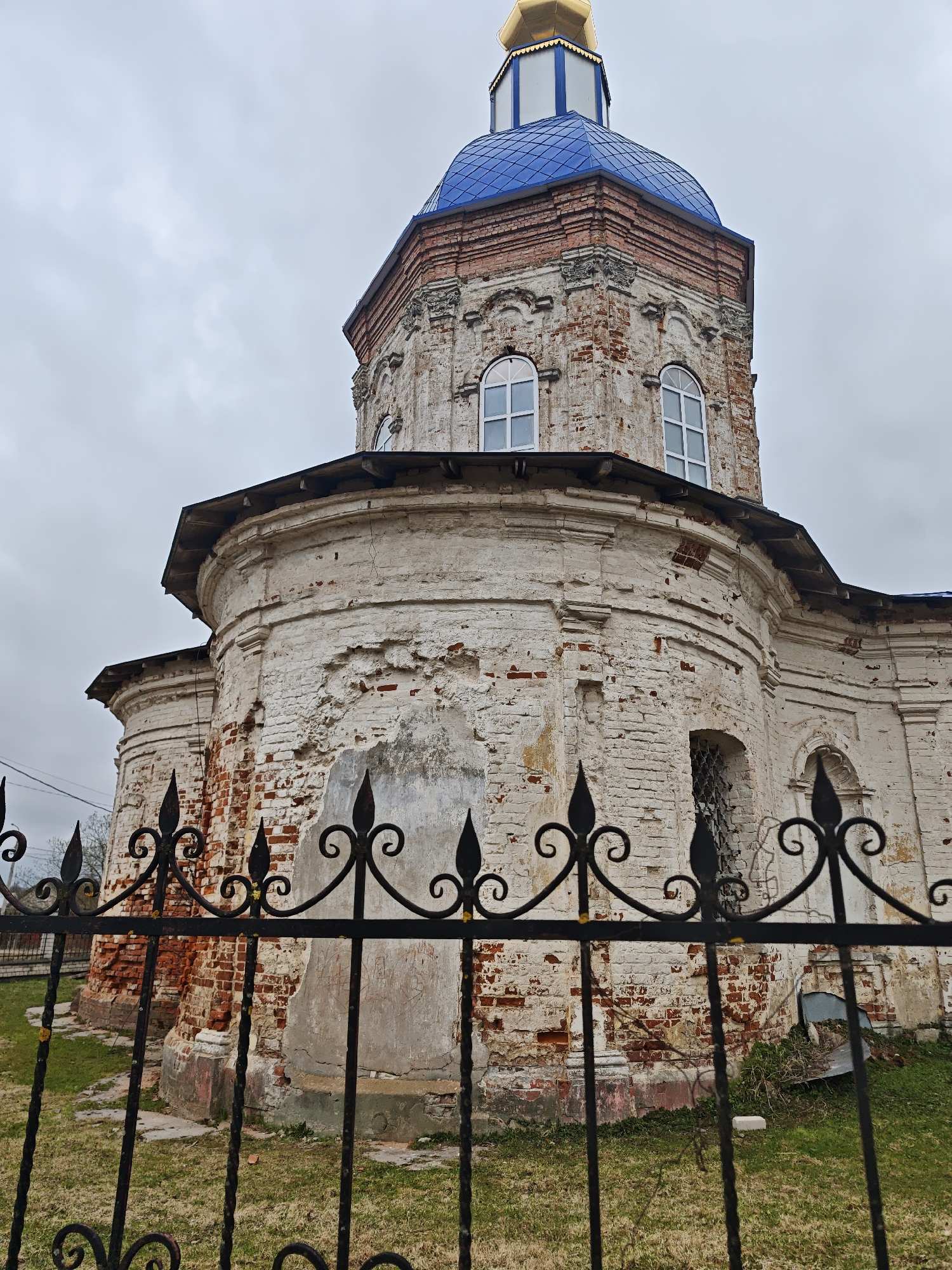 Church photographed in Russian village shows weathered brick architecture