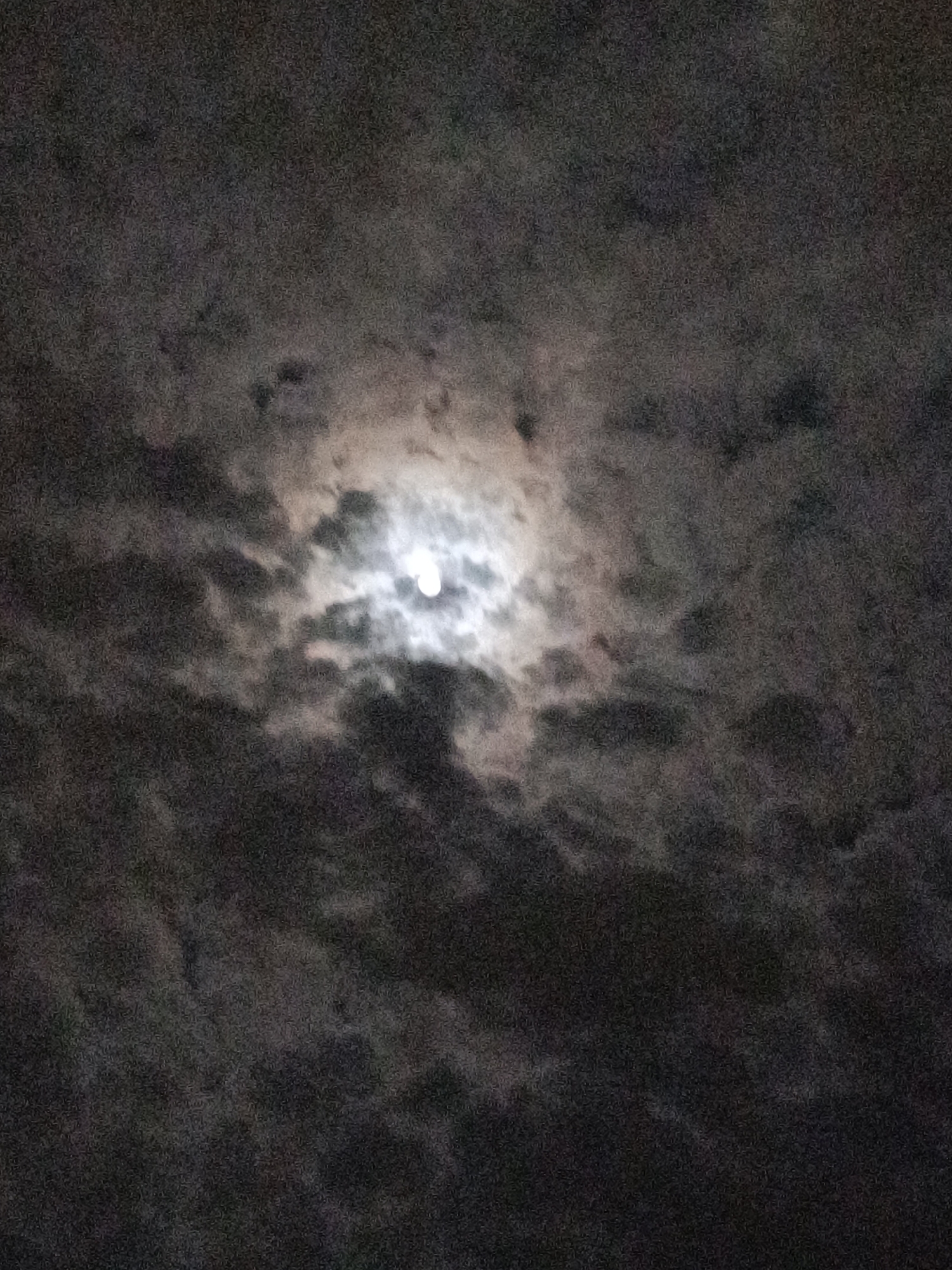 Cloudy moonlight observed over Sofia evening sky