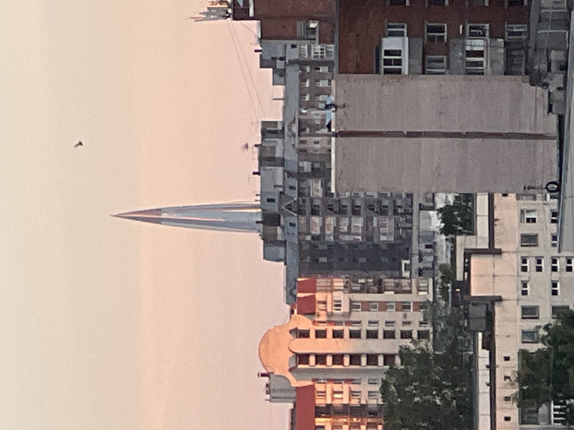 Sunset over Sinyavino rooftops, summer evening