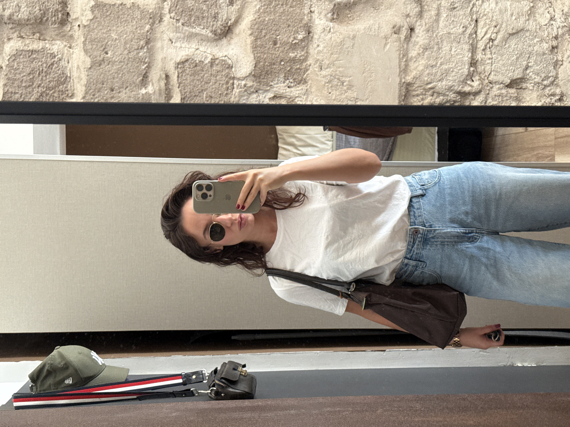 Mirror selfie in a Tel Aviv apartment, casual everyday look.
