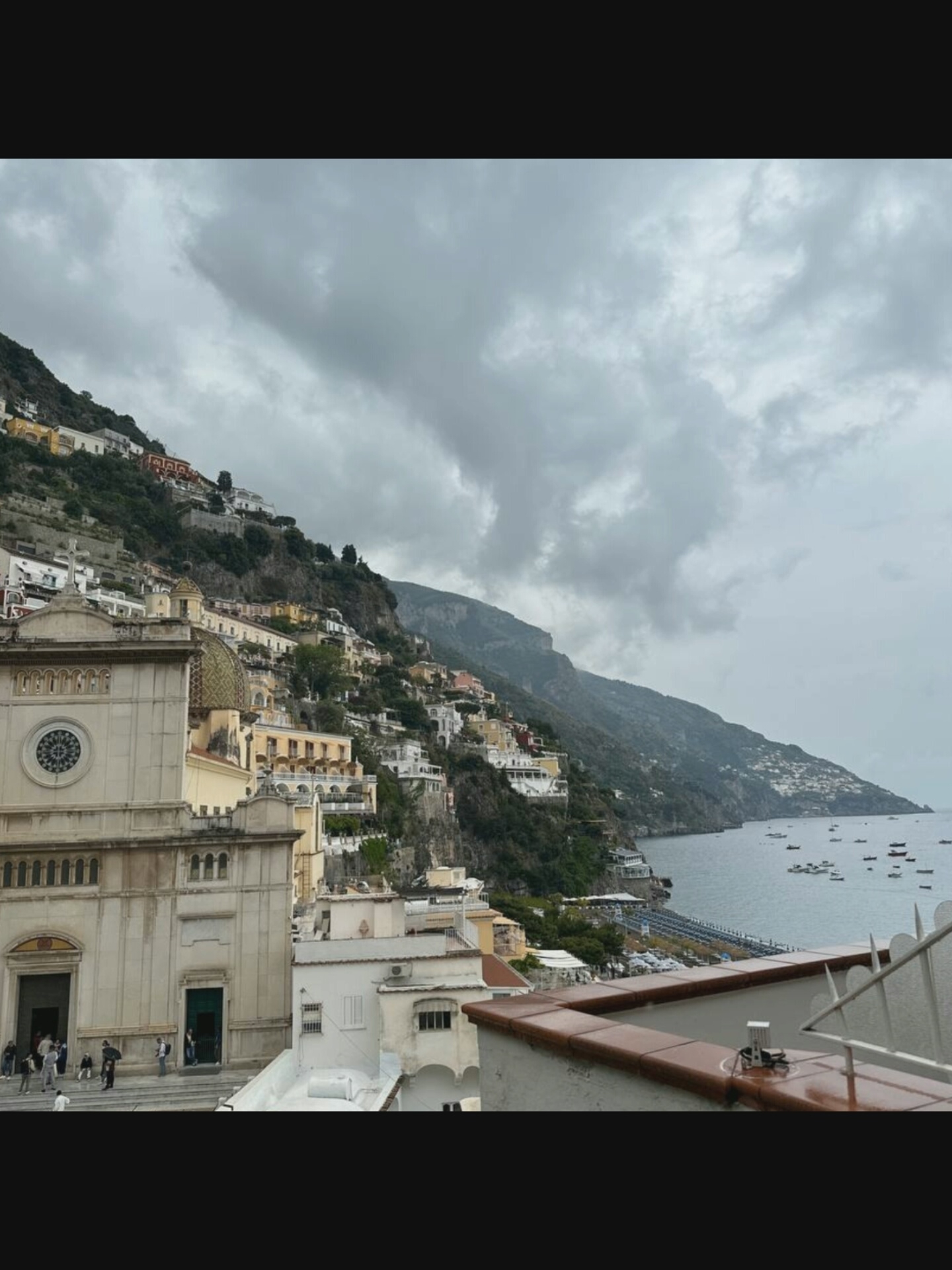 Mediterranean hillside town streets, harbor views, and a tattoo session
