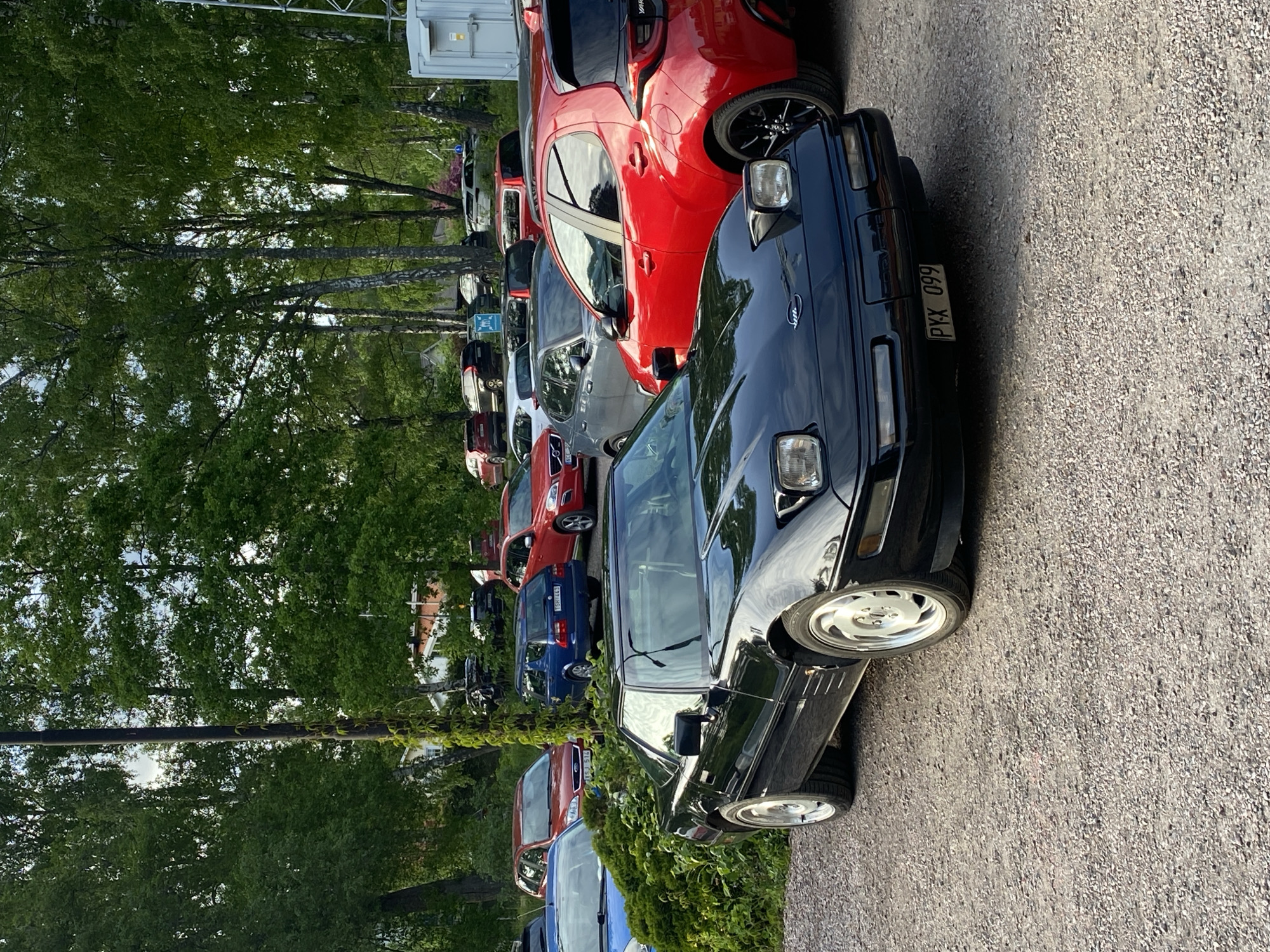 Black sports car spotted parked on gravel road in Uppsala