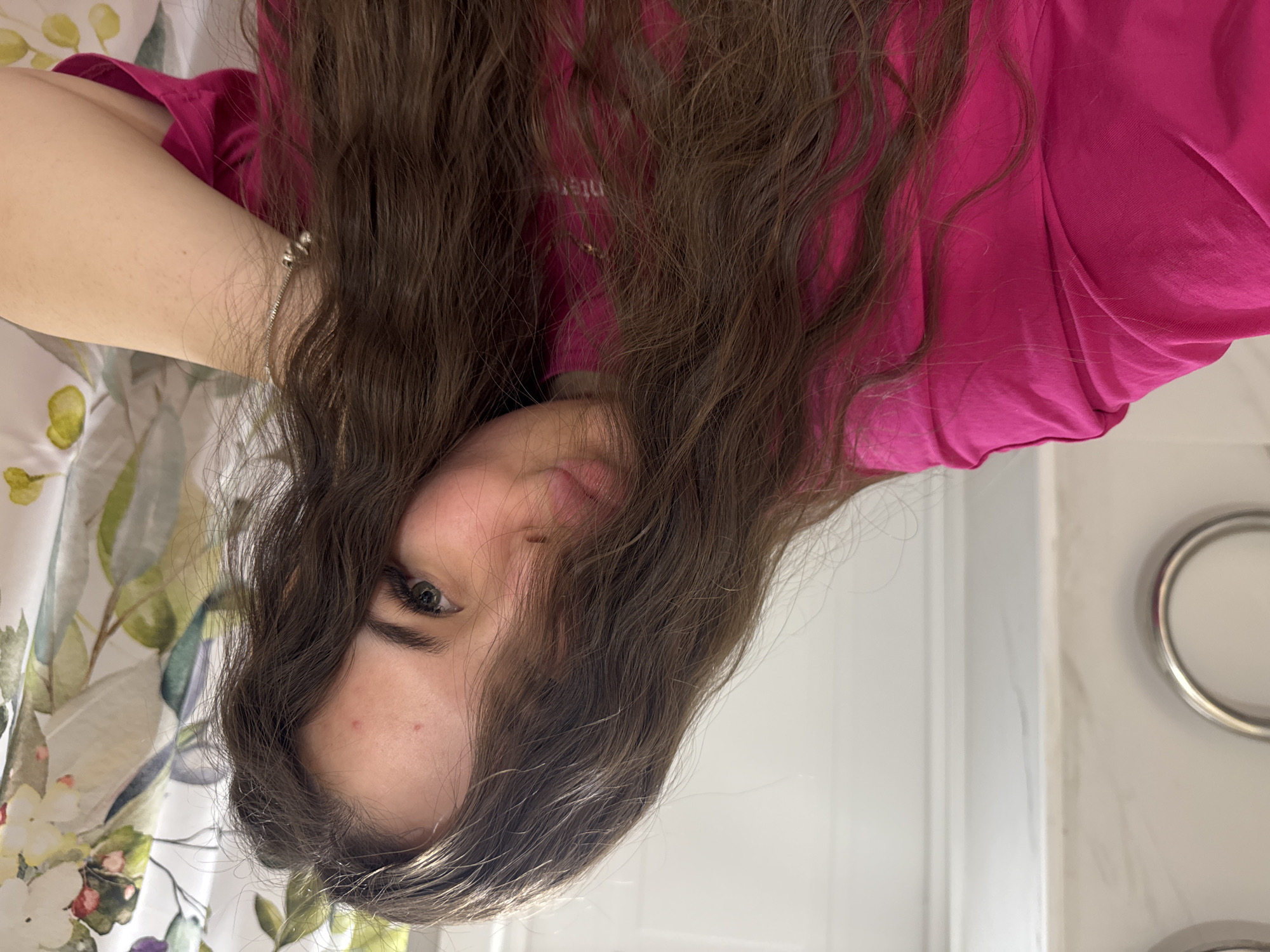 Young woman takes selfies, eats pasta in Russian home