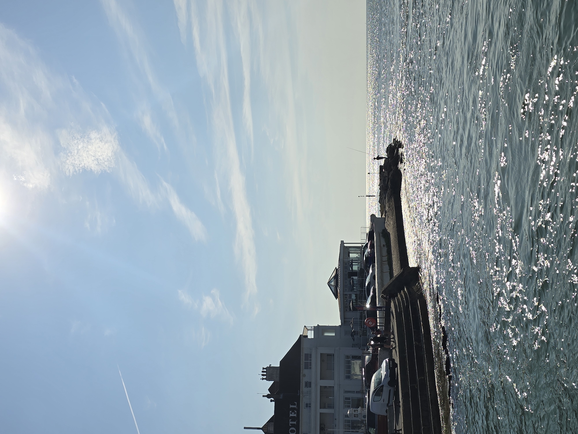 Sunny morning on the Poole waterfront, fishing and hotel views